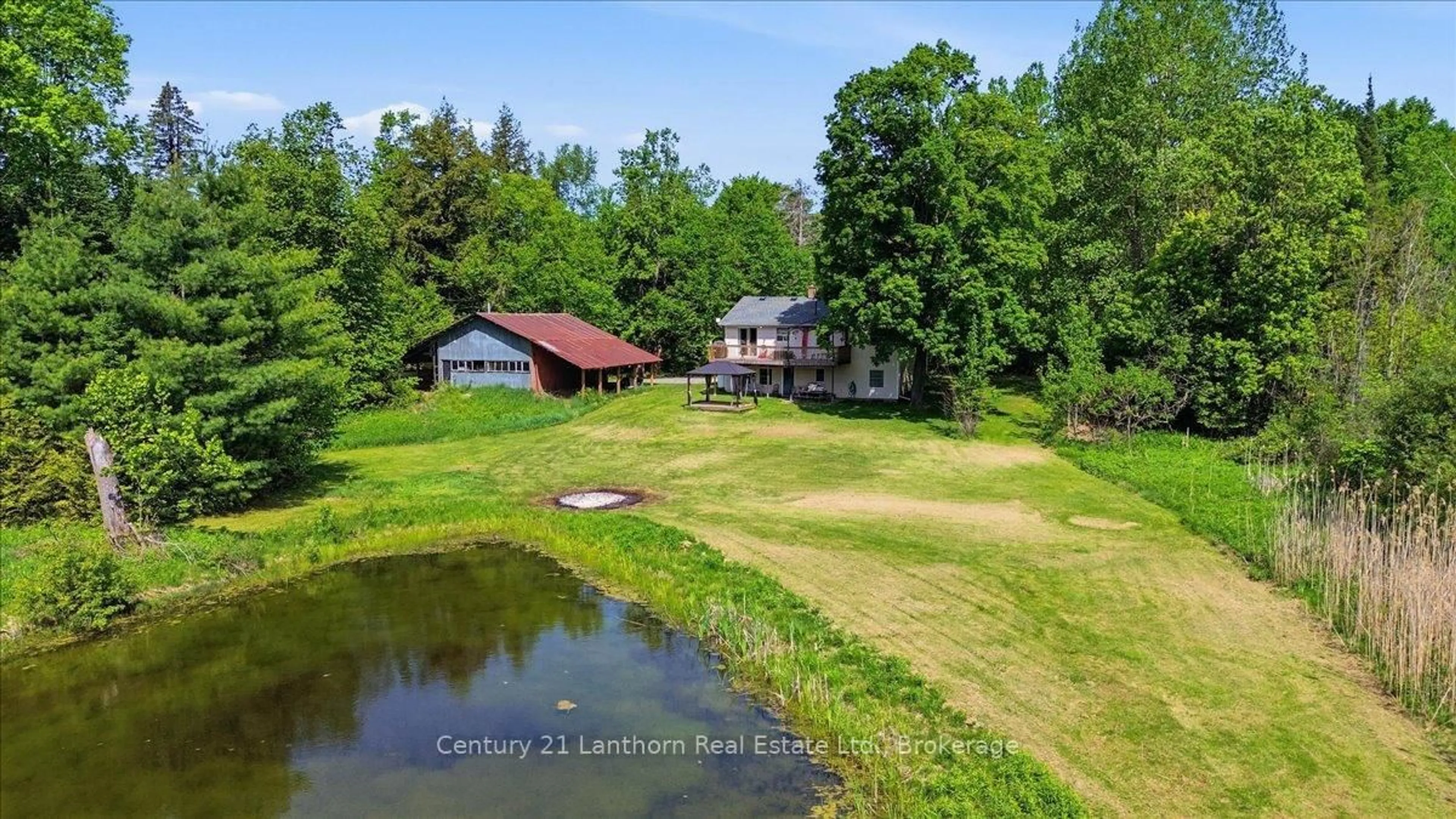 A pic from outside/outdoor area/front of a property/back of a property/a pic from drone, water/lake/river/ocean view for 854 Beaver Creek Rd, Limoges Ontario K0K 2M0