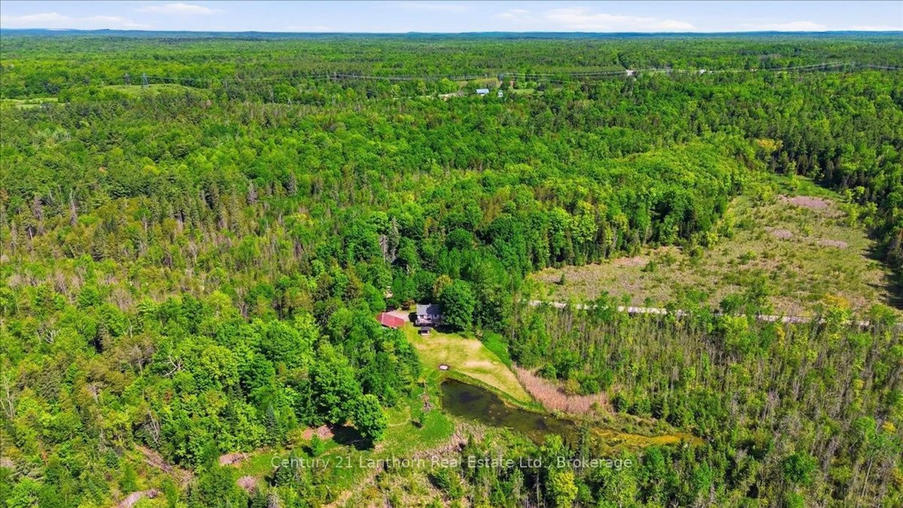 A pic from outside/outdoor area/front of a property/back of a property/a pic from drone, forest/trees view for 854 Beaver Creek Rd, Limoges Ontario K0K 2M0