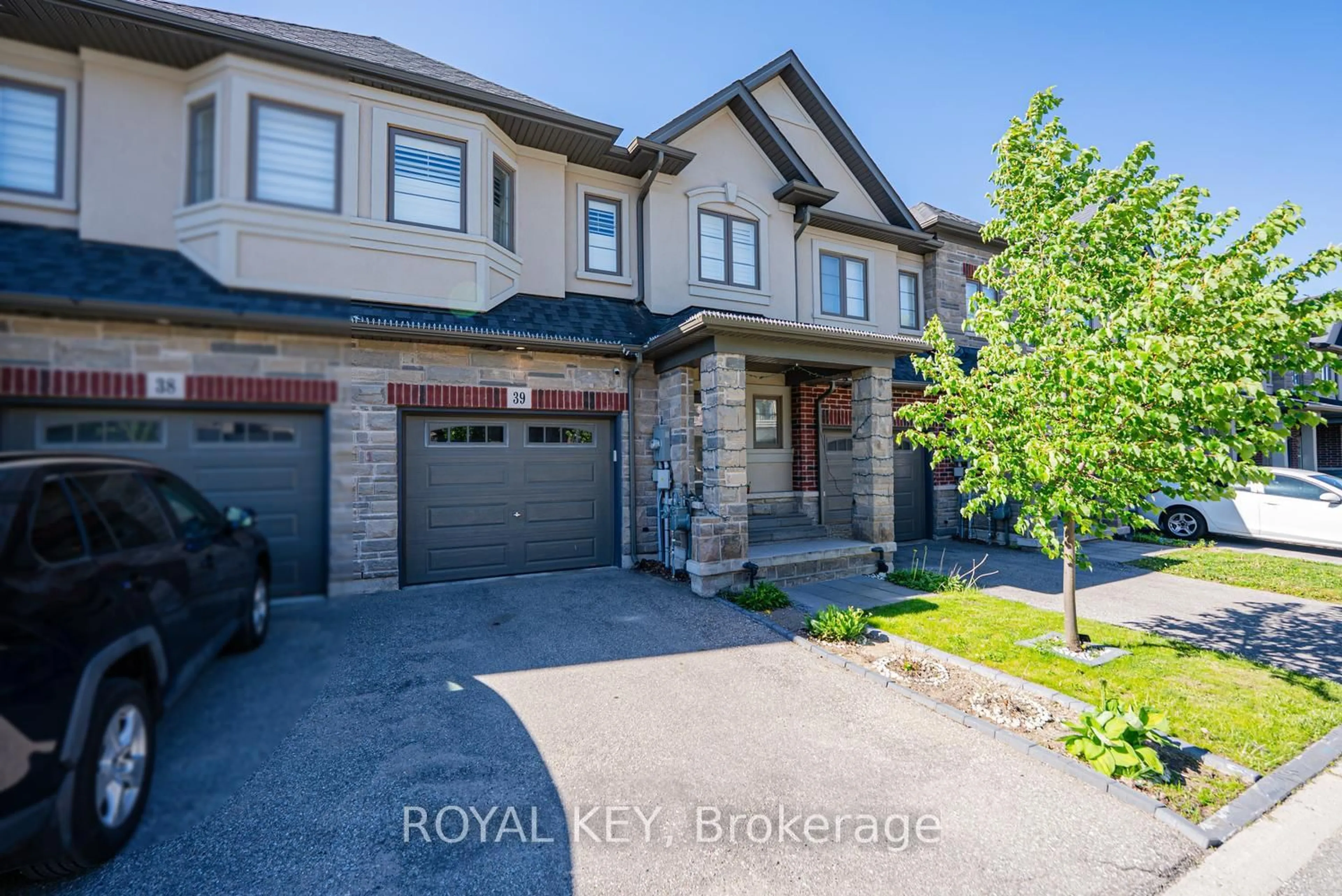 Home with brick exterior material, street for 324 Equestrian Way #39, Cambridge Ontario N3E 0C1