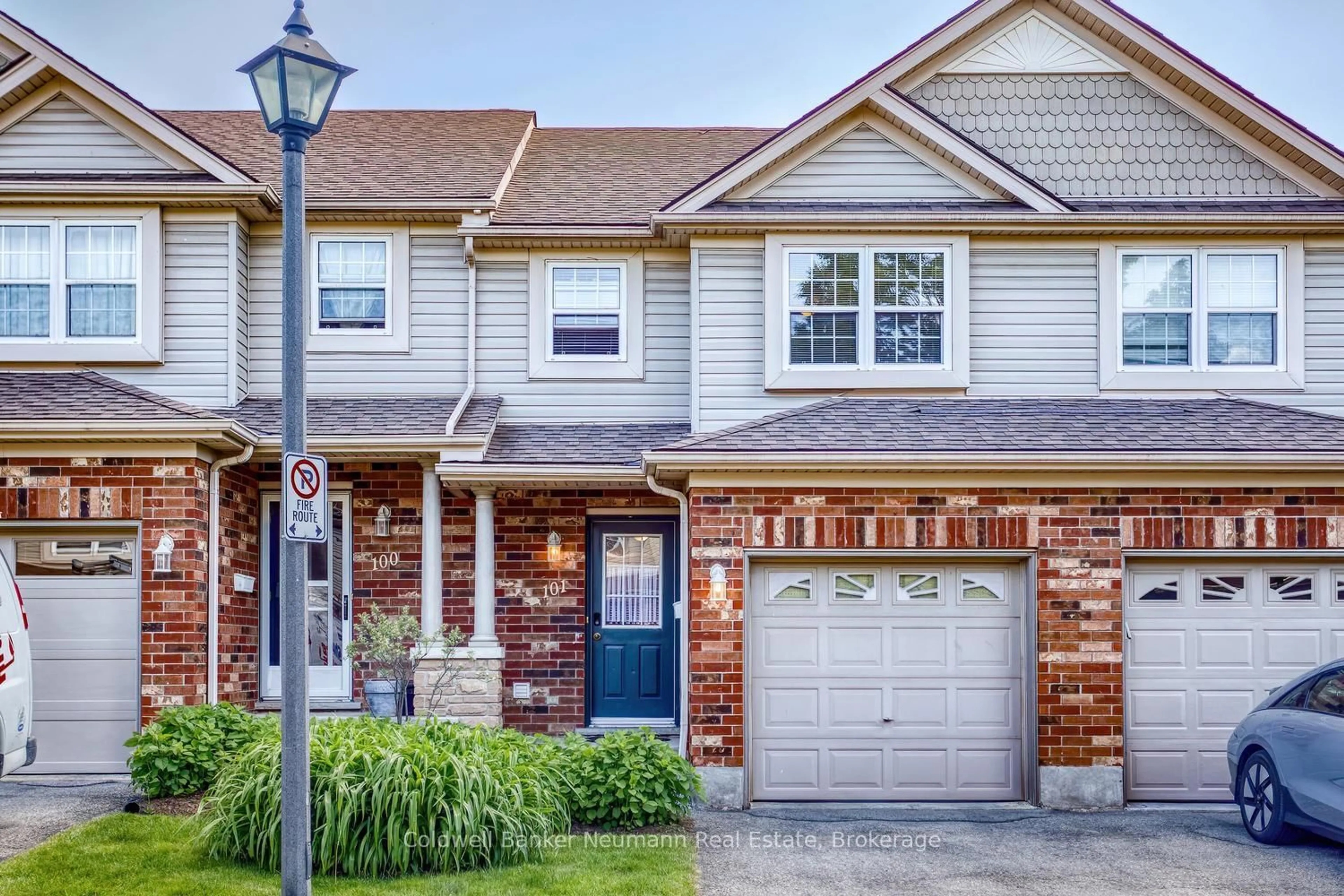 Home with brick exterior material, street for 30 Imperial Rd #101, Guelph Ontario N1K 1Y5