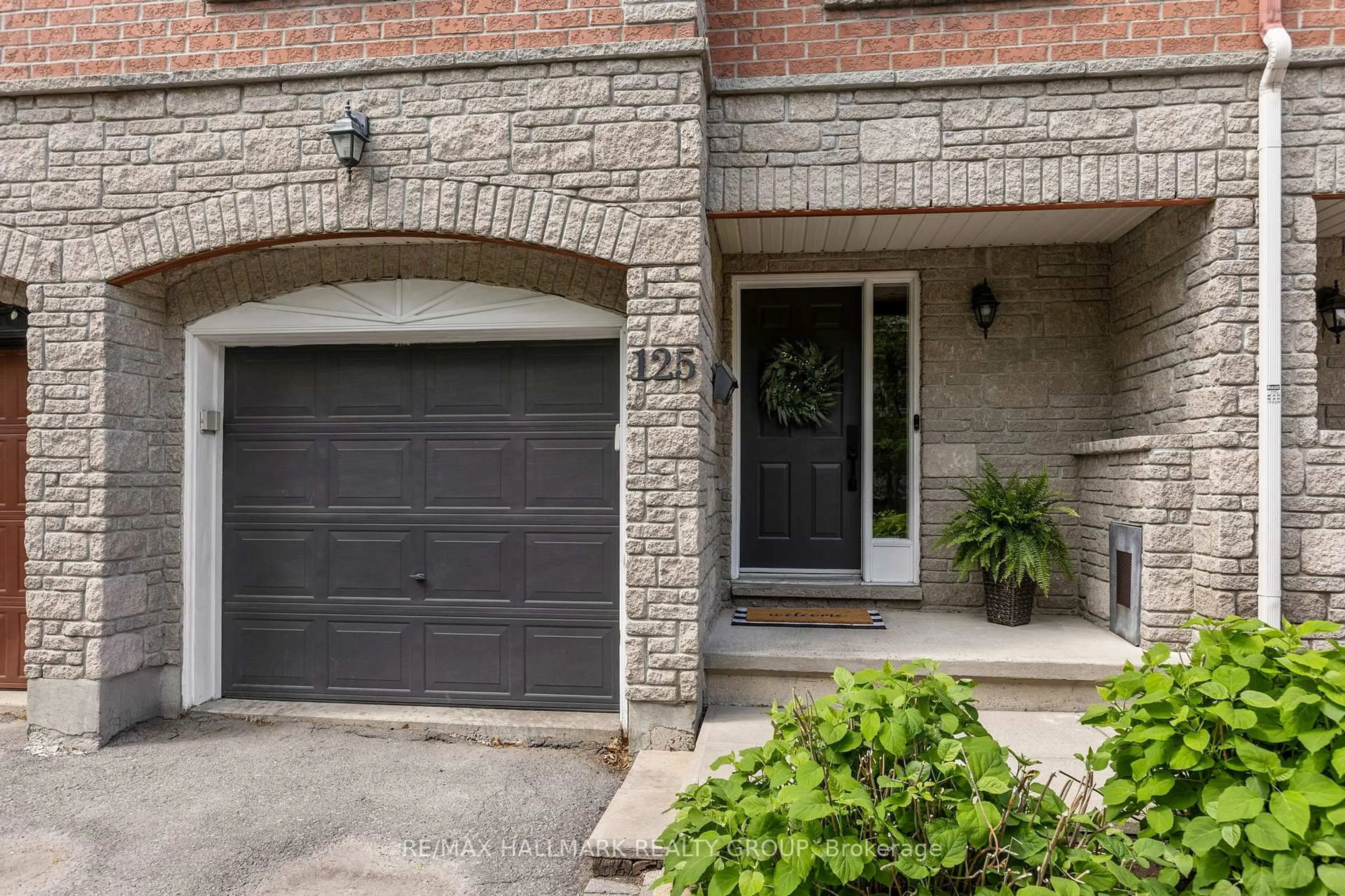 Home with brick exterior material, street for 125 Arcola Private, Ottawa Ontario K1K 4W9