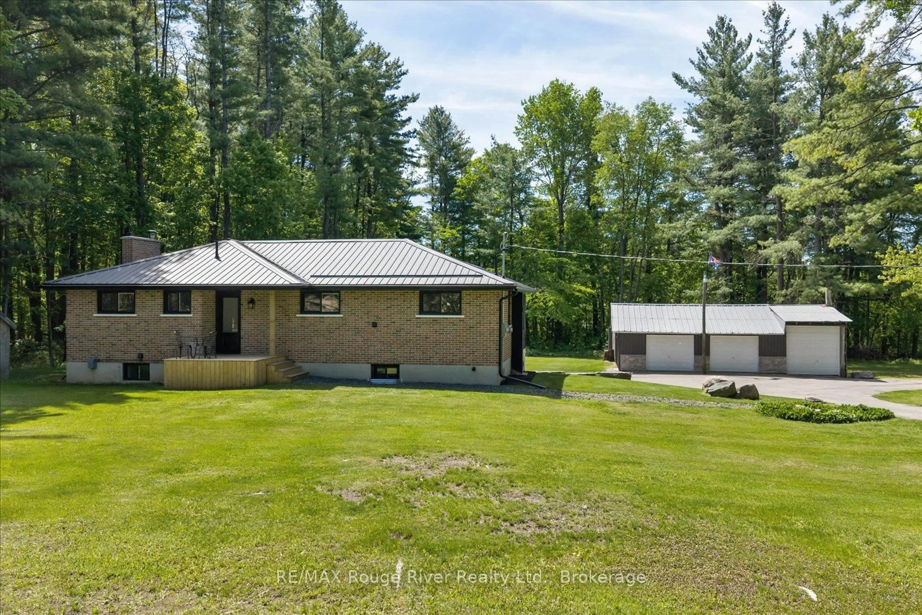 A pic from outside/outdoor area/front of a property/back of a property/a pic from drone, forest/trees view for 1004 Telecom Rd, Kawartha Lakes Ontario L0A 1K0