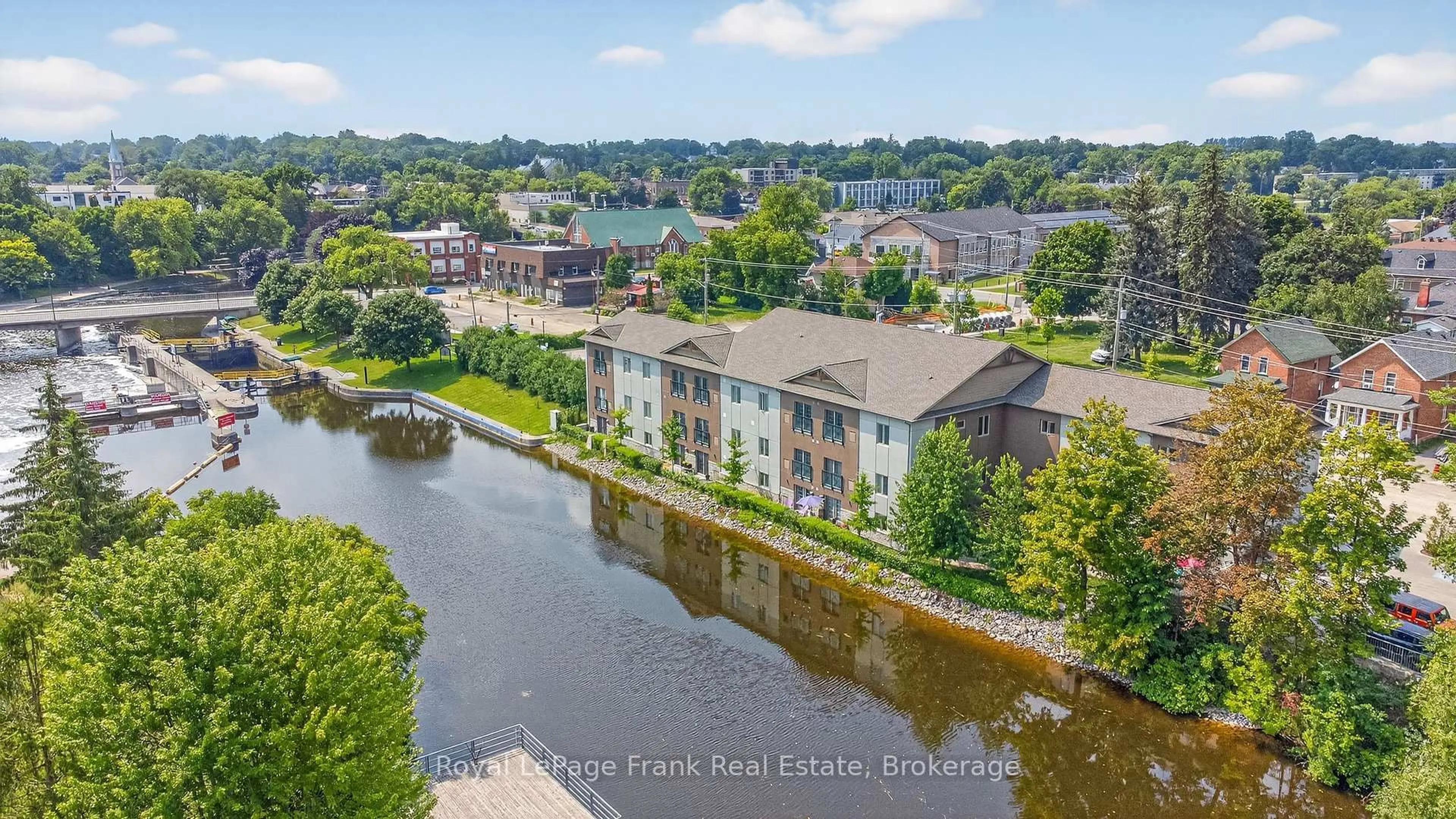 A pic from outside/outdoor area/front of a property/back of a property/a pic from drone, water/lake/river/ocean view for 25 King St #103, Kawartha Lakes Ontario K9V 1C7