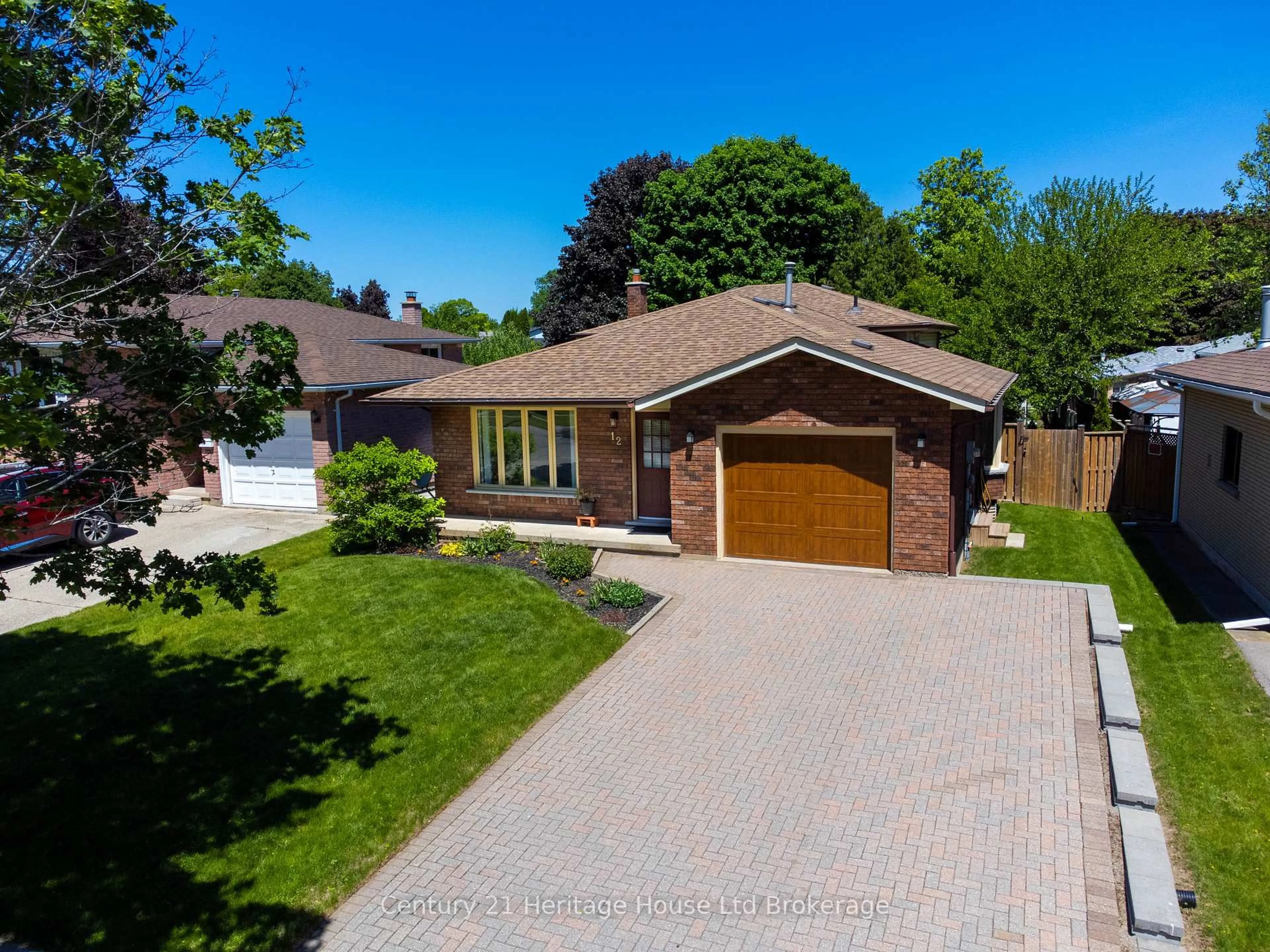 Home with brick exterior material, street for 12 Spartan Dr, Brantford Ontario N3R 6C7
