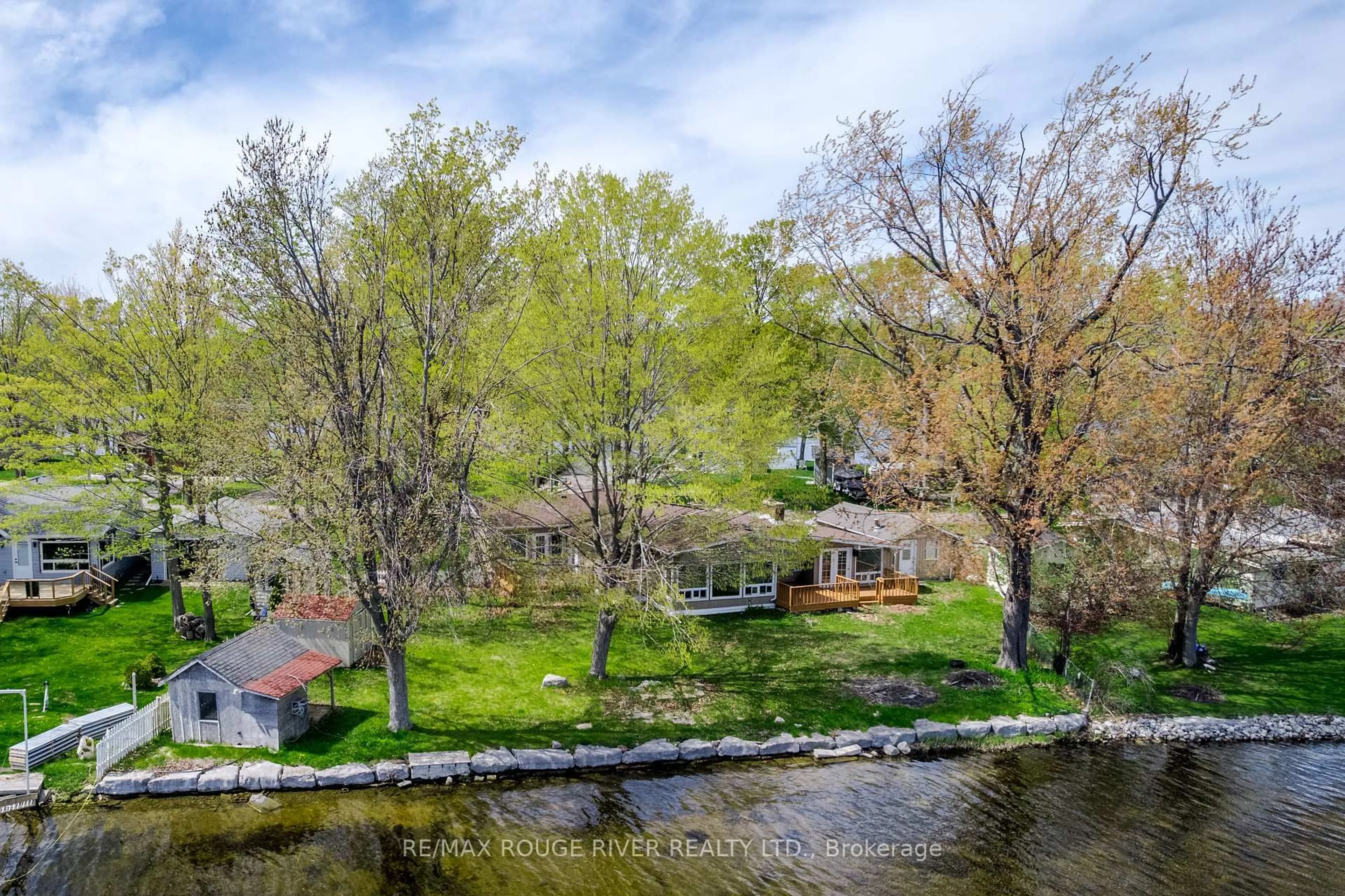 A pic from outside/outdoor area/front of a property/back of a property/a pic from drone, water/lake/river/ocean view for 30 Edgewater Dr, Selwyn Ontario K0L 1T0