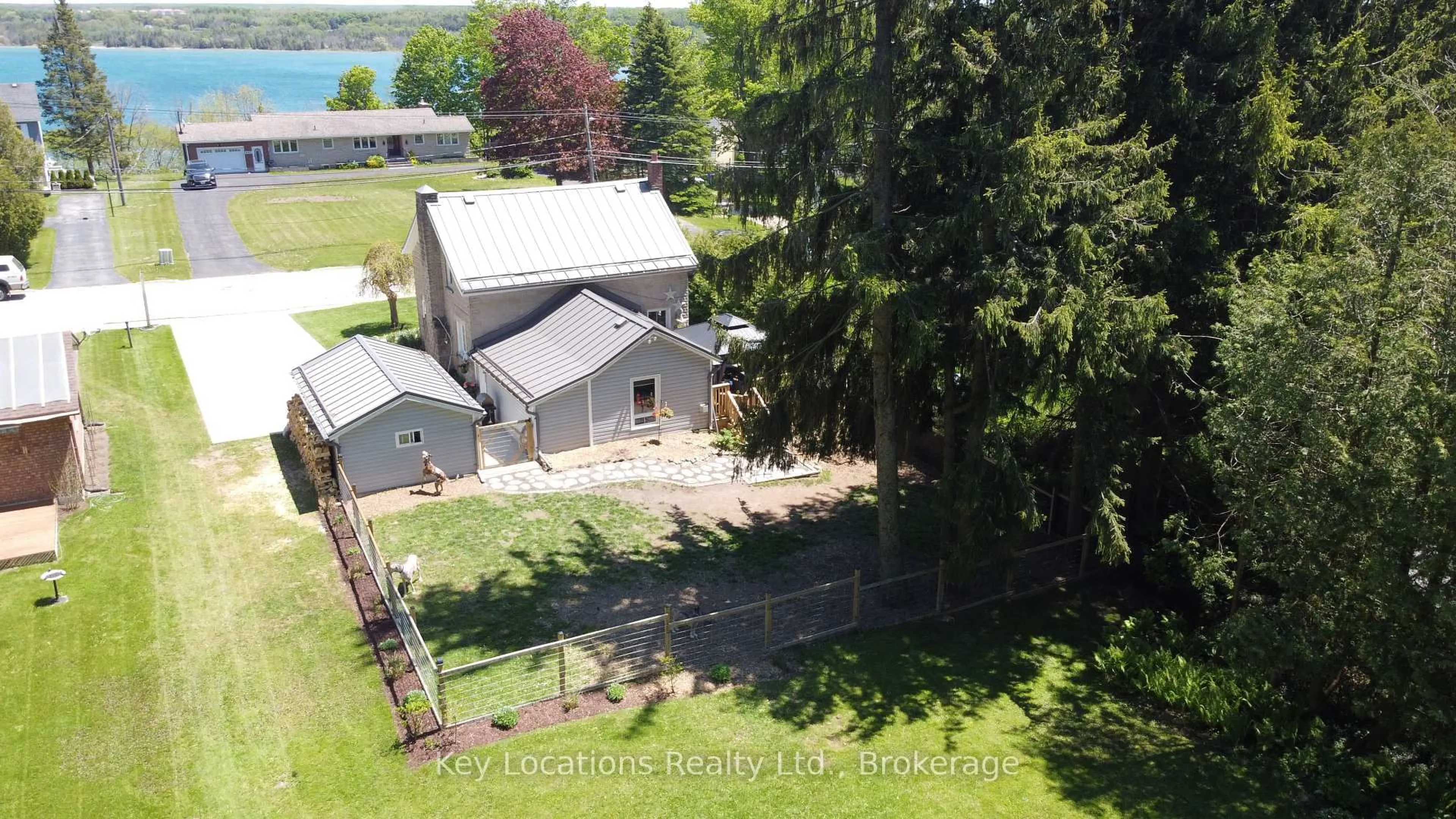 A pic from outside/outdoor area/front of a property/back of a property/a pic from drone, water/lake/river/ocean view for 724 Gould St, South Bruce Peninsula Ontario N0H 2T0