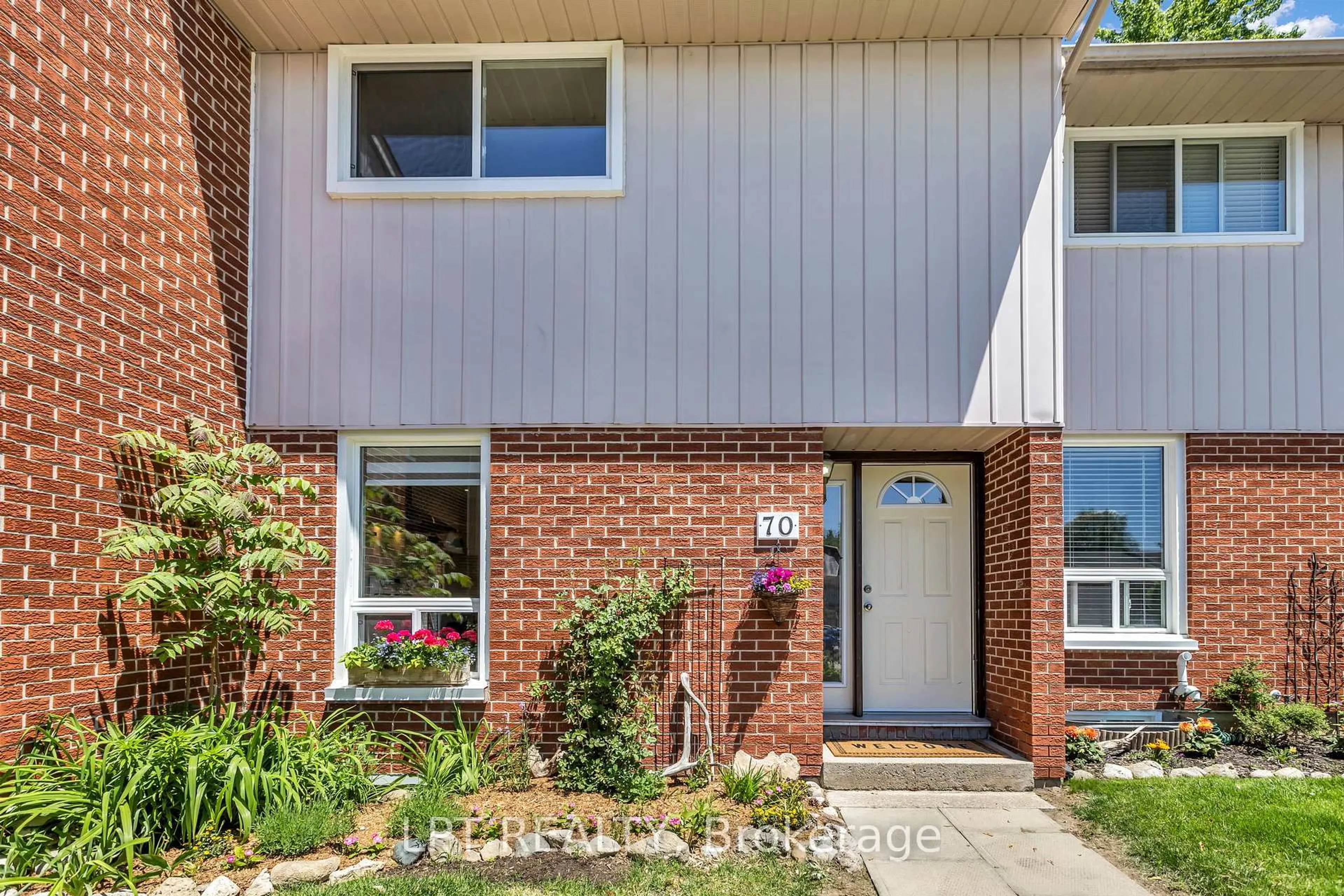 Home with brick exterior material, street for 49 Rhonda Rd #70, Guelph Ontario N1H 7A4