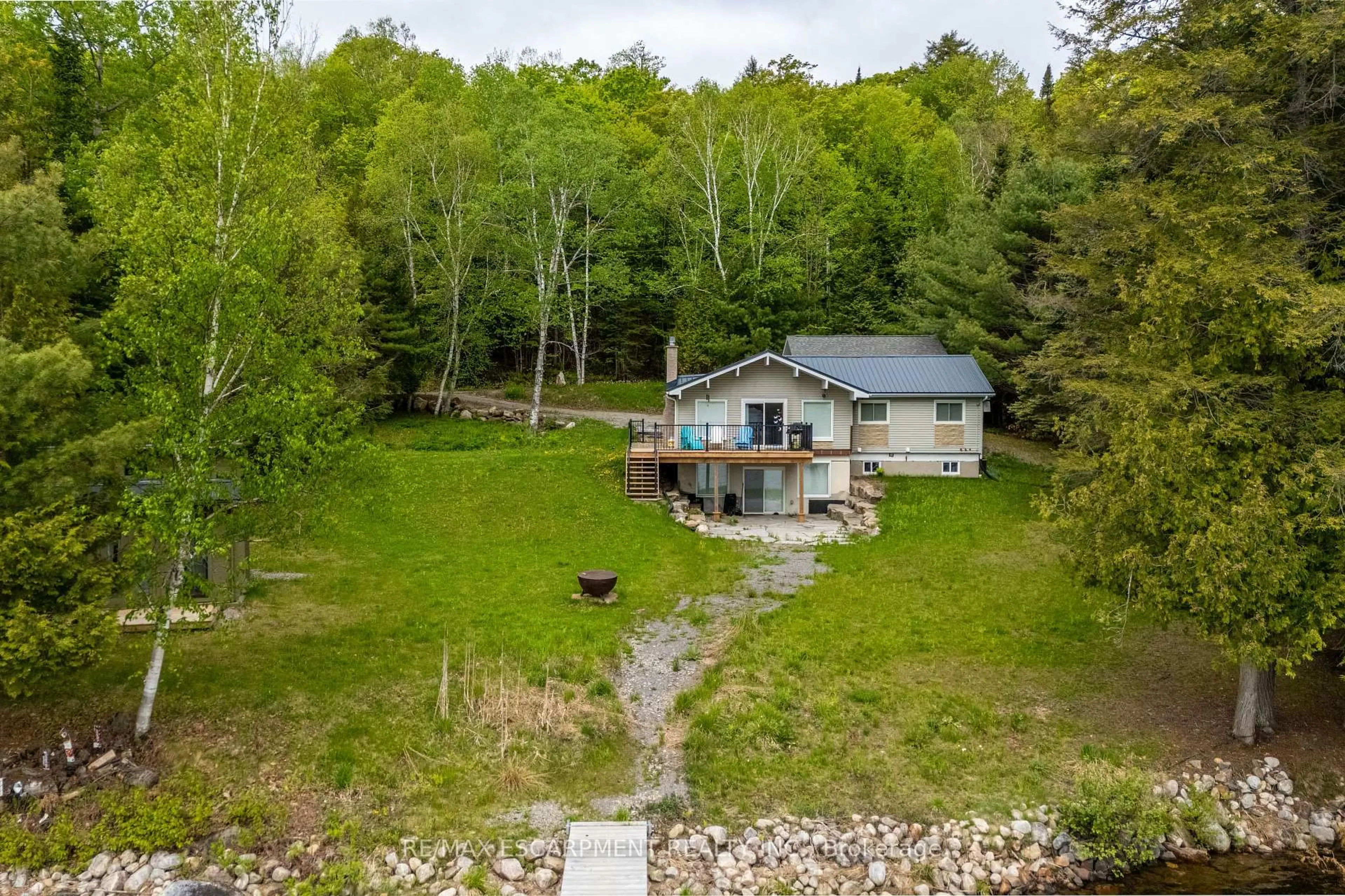 A pic from outside/outdoor area/front of a property/back of a property/a pic from drone, water/lake/river/ocean view for 1056 Inawendawin Rd, Lake of Bays Ontario P0B 1A0