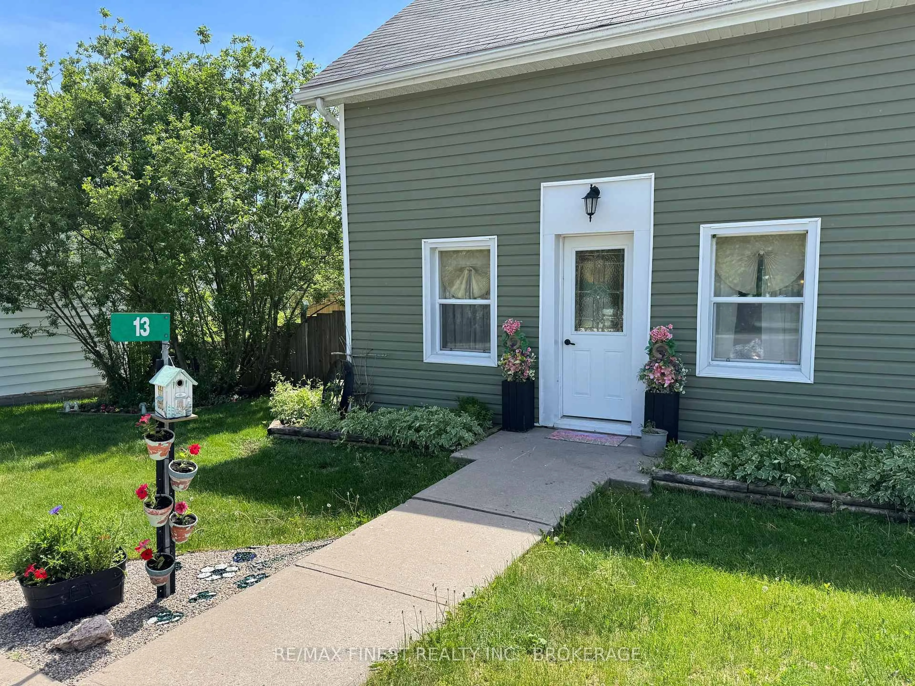 A pic from outside/outdoor area/front of a property/back of a property/a pic from drone, street for 13 Concession St, Tamworth Ontario K0K 3G0