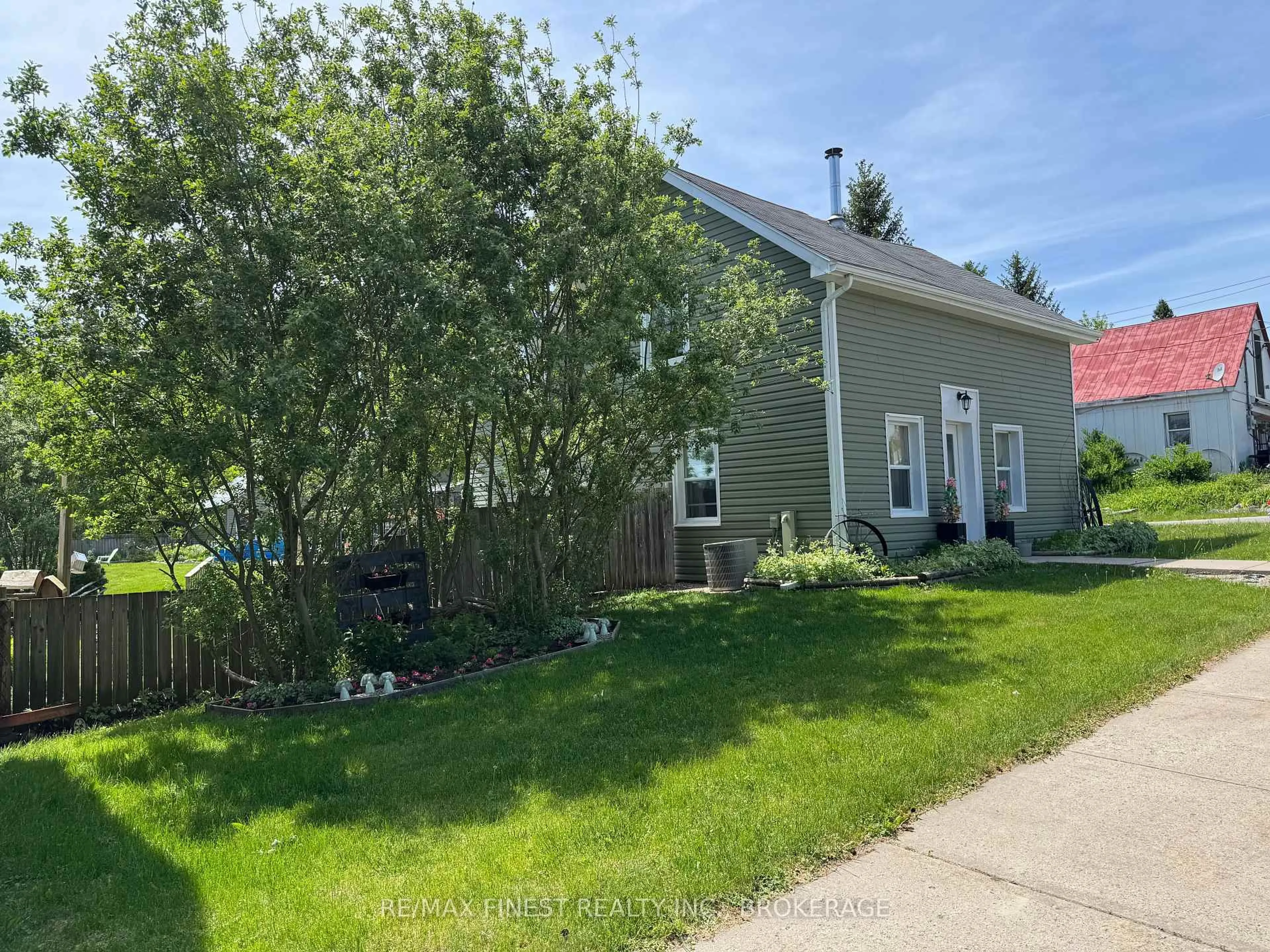 Home with vinyl exterior material, street for 13 Concession St, Tamworth Ontario K0K 3G0