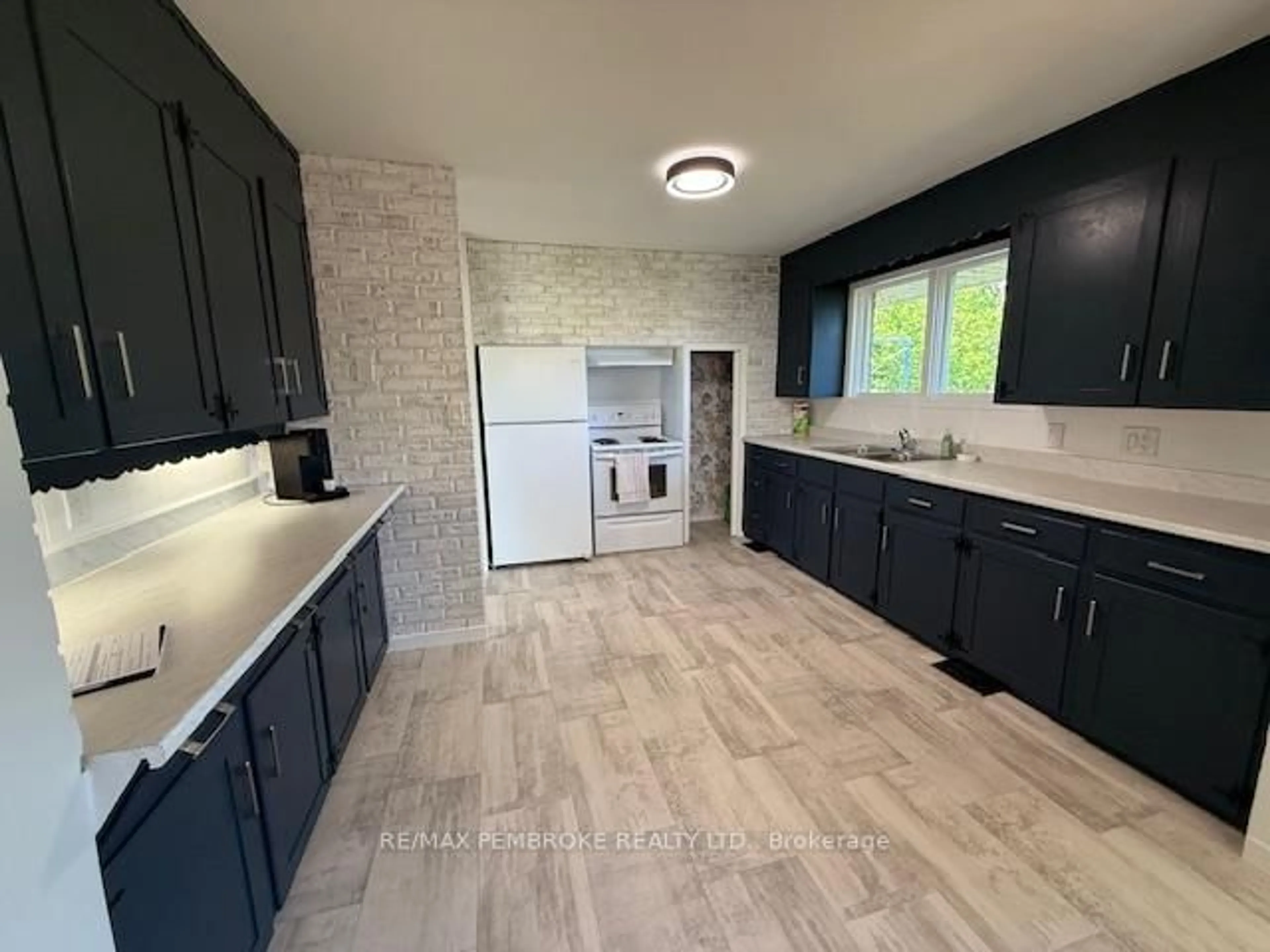 Open concept kitchen, ceramic/tile floor for 410 Green Lake Rd, Pembroke Ontario K8A 6W4