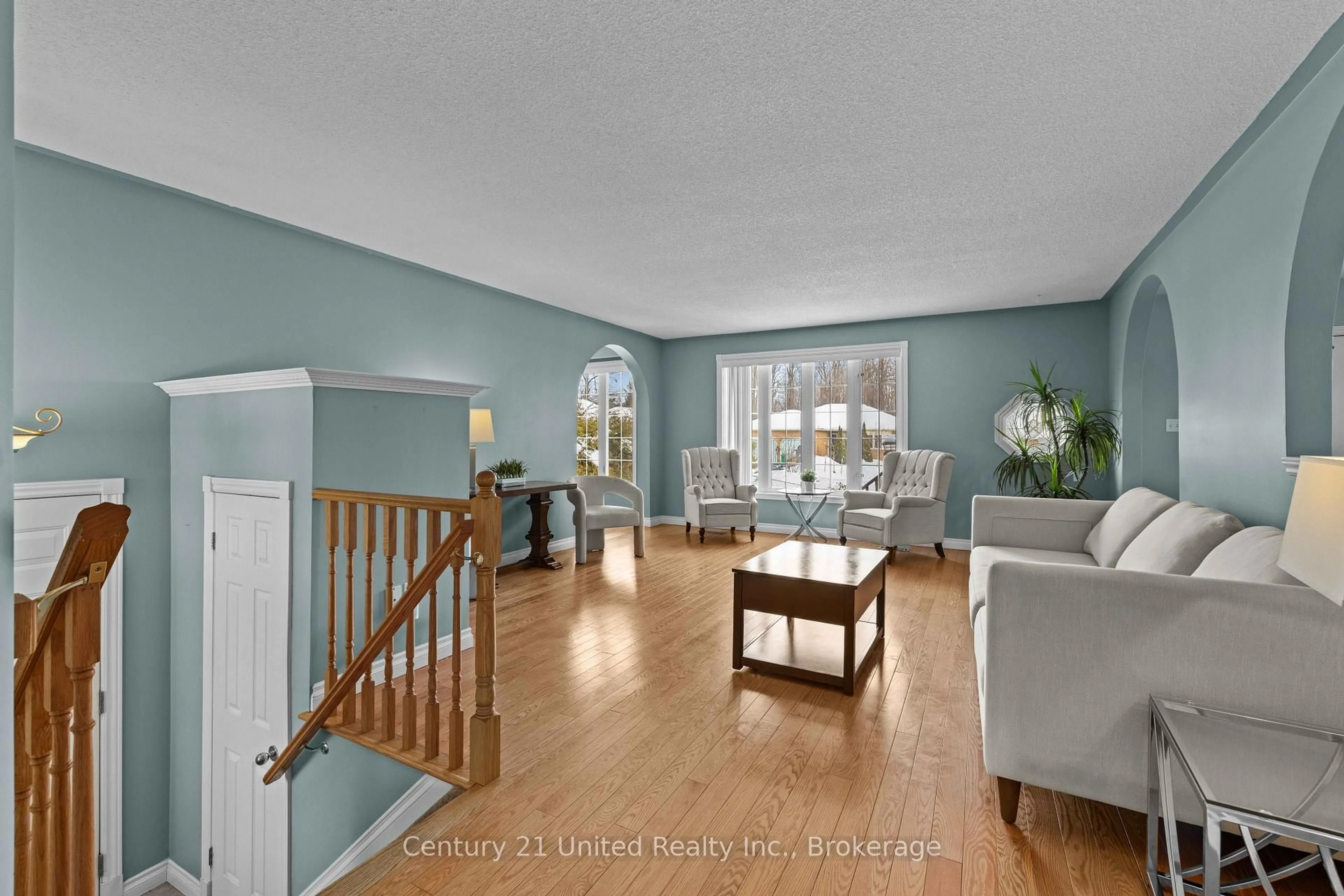 Living room with furniture, wood/laminate floor for 640 Brealey Dr, Peterborough Ontario K9K 2M7