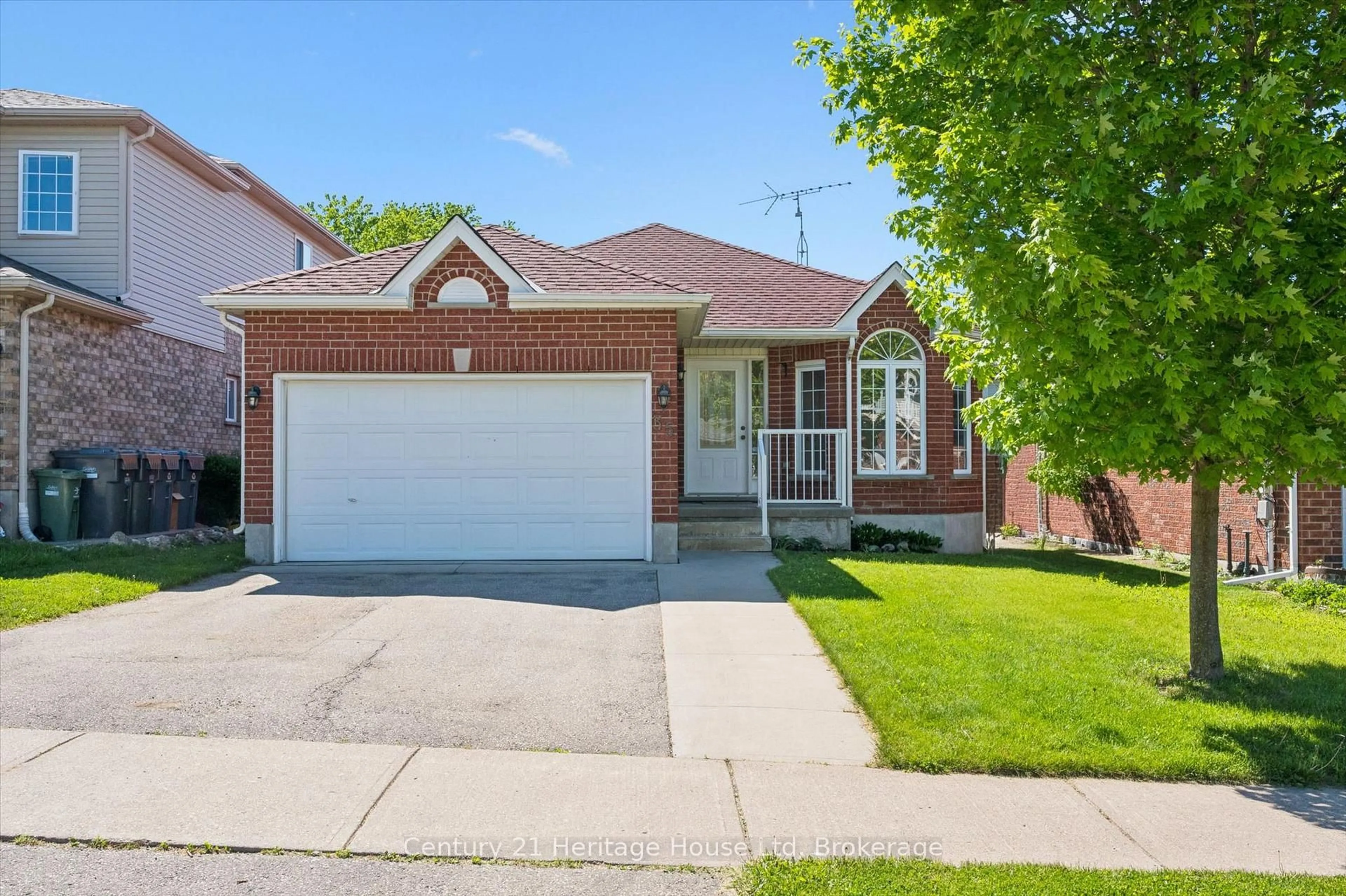 Home with brick exterior material, street for 35 Shackleton Dr, Guelph Ontario N1E 7K5