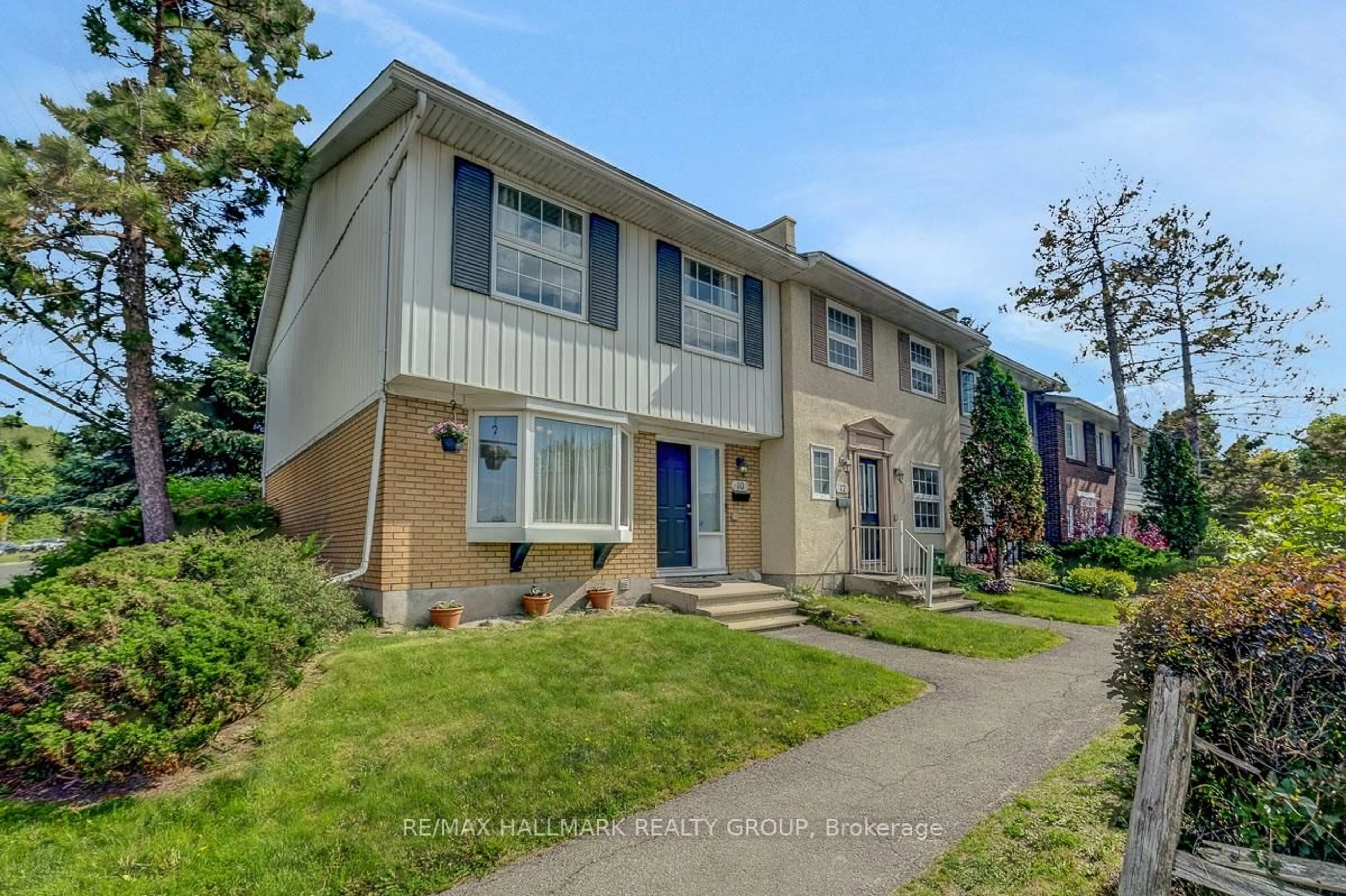 Home with vinyl exterior material, street for 10 Greenbank Rd, Ottawa Ontario K2H 5T9