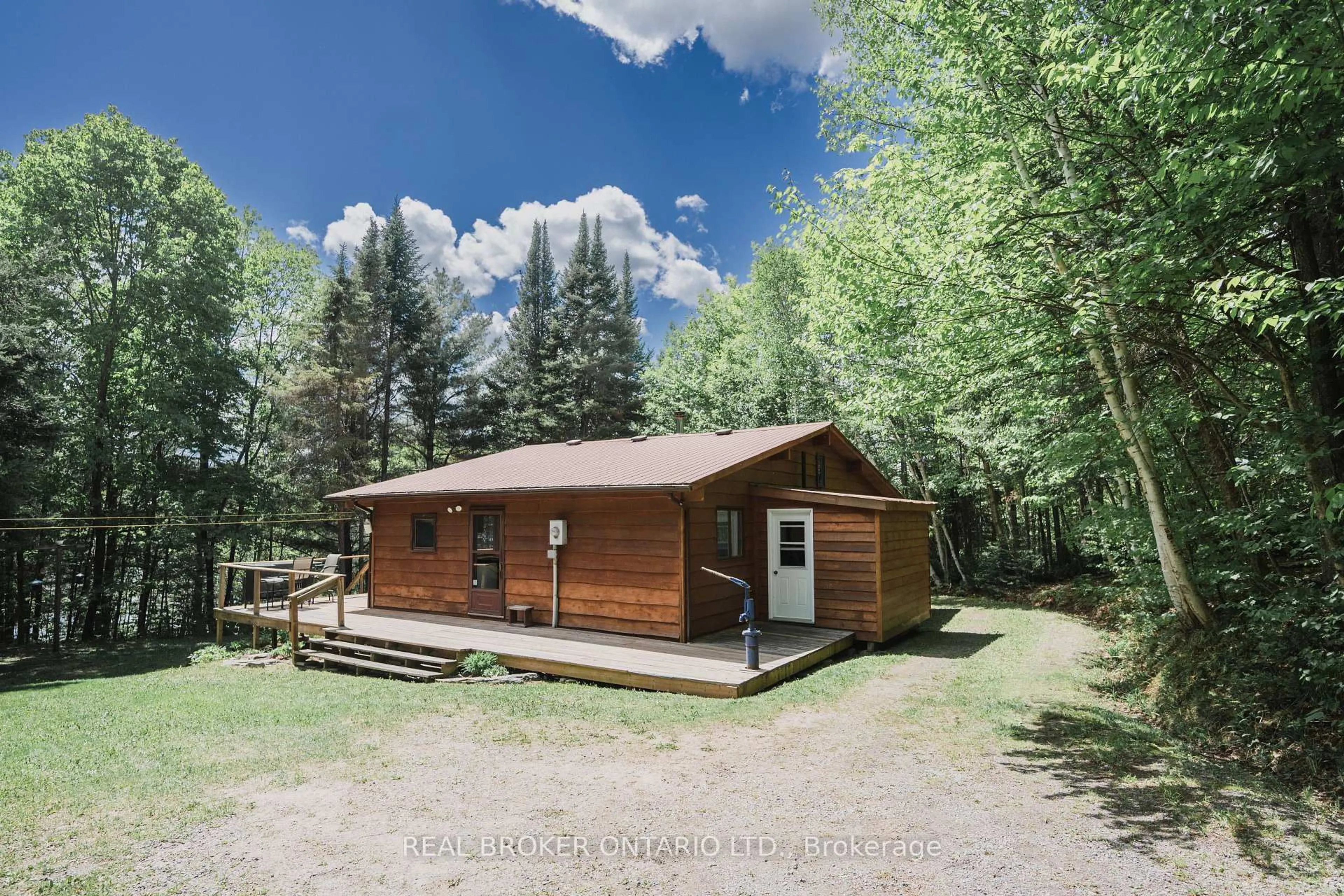 A pic from outside/outdoor area/front of a property/back of a property/a pic from drone, unknown for 888 Bray Lake Rd, Machar Ontario P0A 1X0