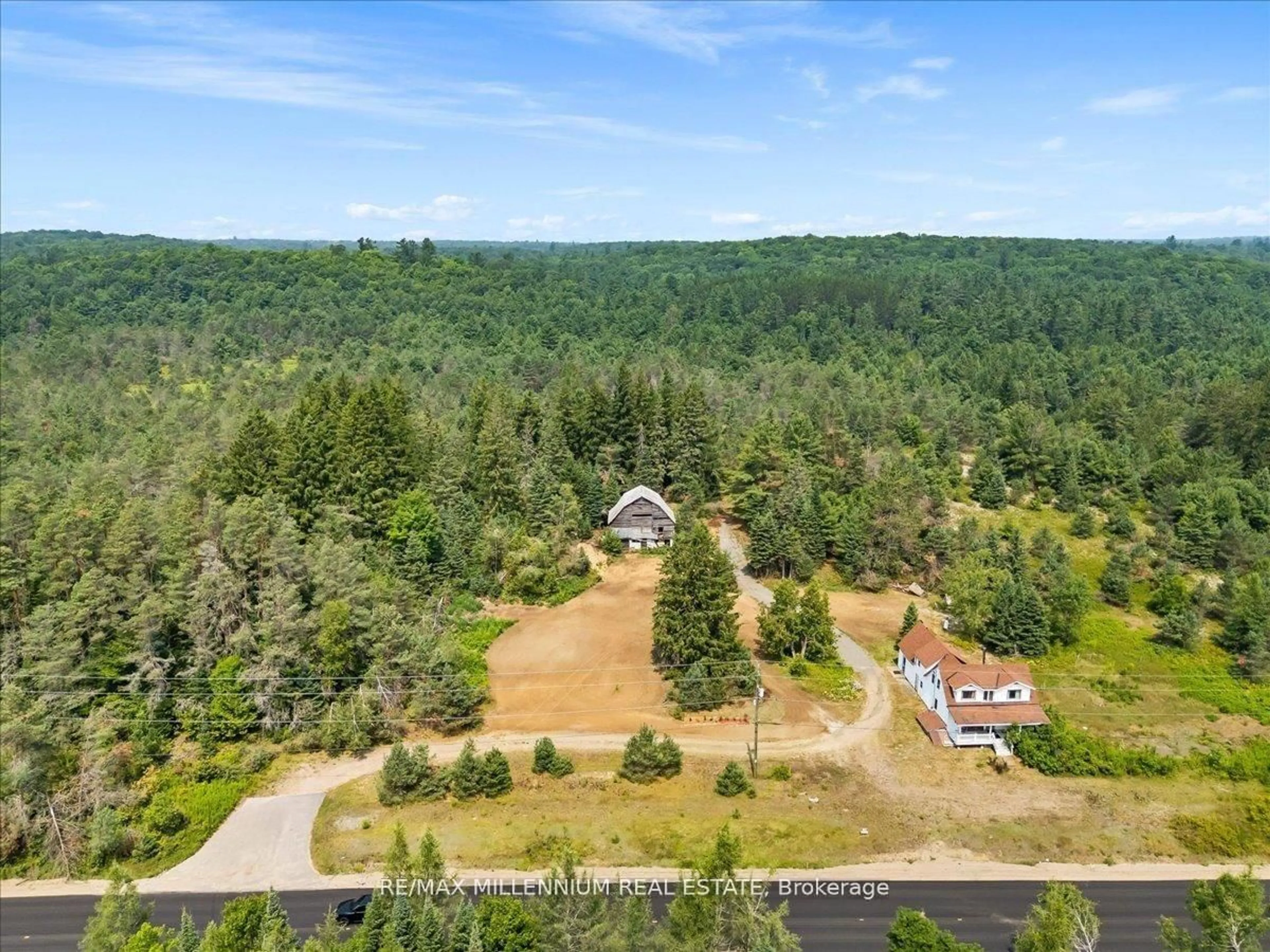 A pic from outside/outdoor area/front of a property/back of a property/a pic from drone, forest/trees view for 3529 Highway 118, Bracebridge Ontario P1L 1X1