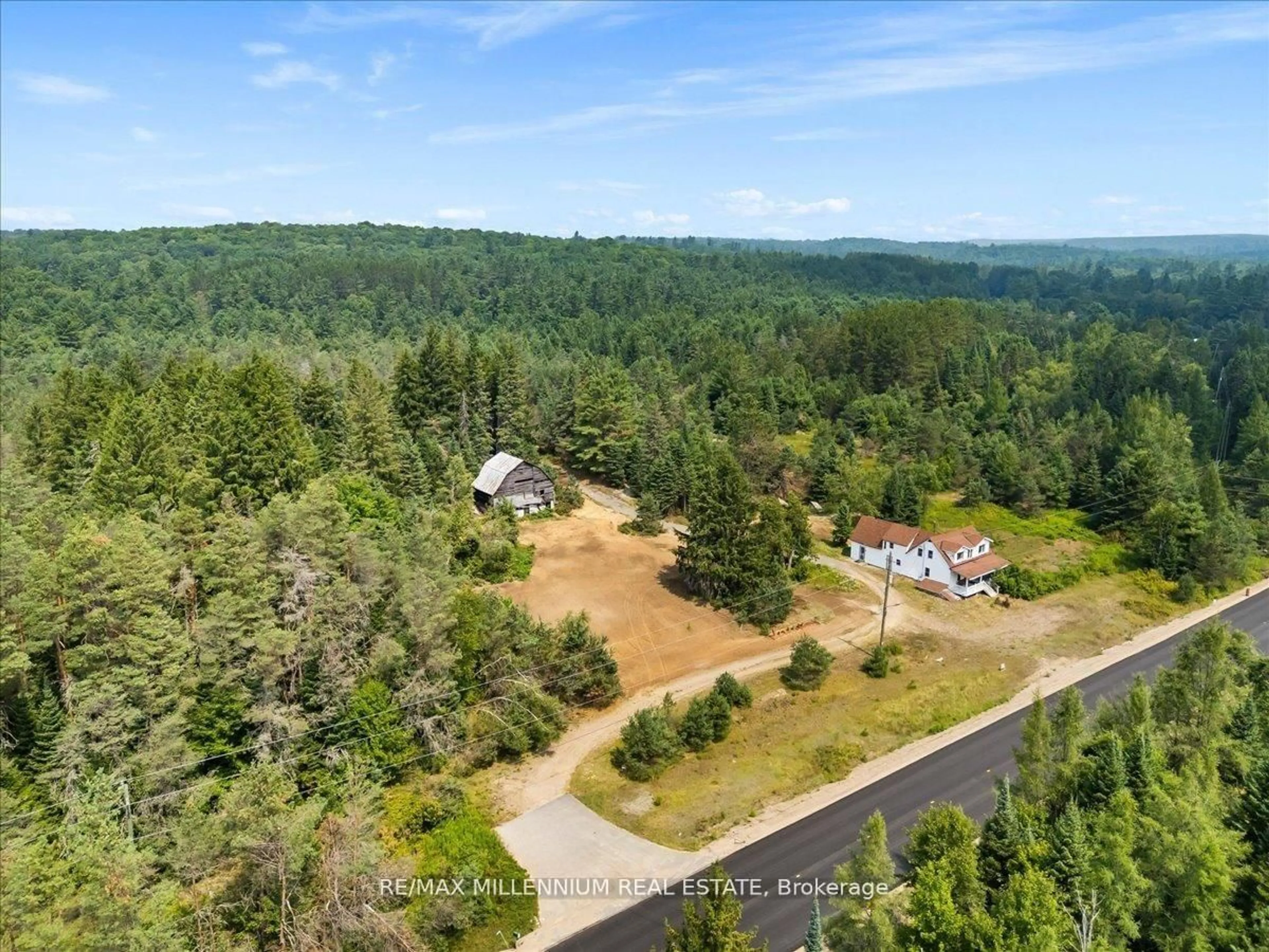 A pic from outside/outdoor area/front of a property/back of a property/a pic from drone, forest/trees view for 3529 Highway 118, Bracebridge Ontario P1L 1X1