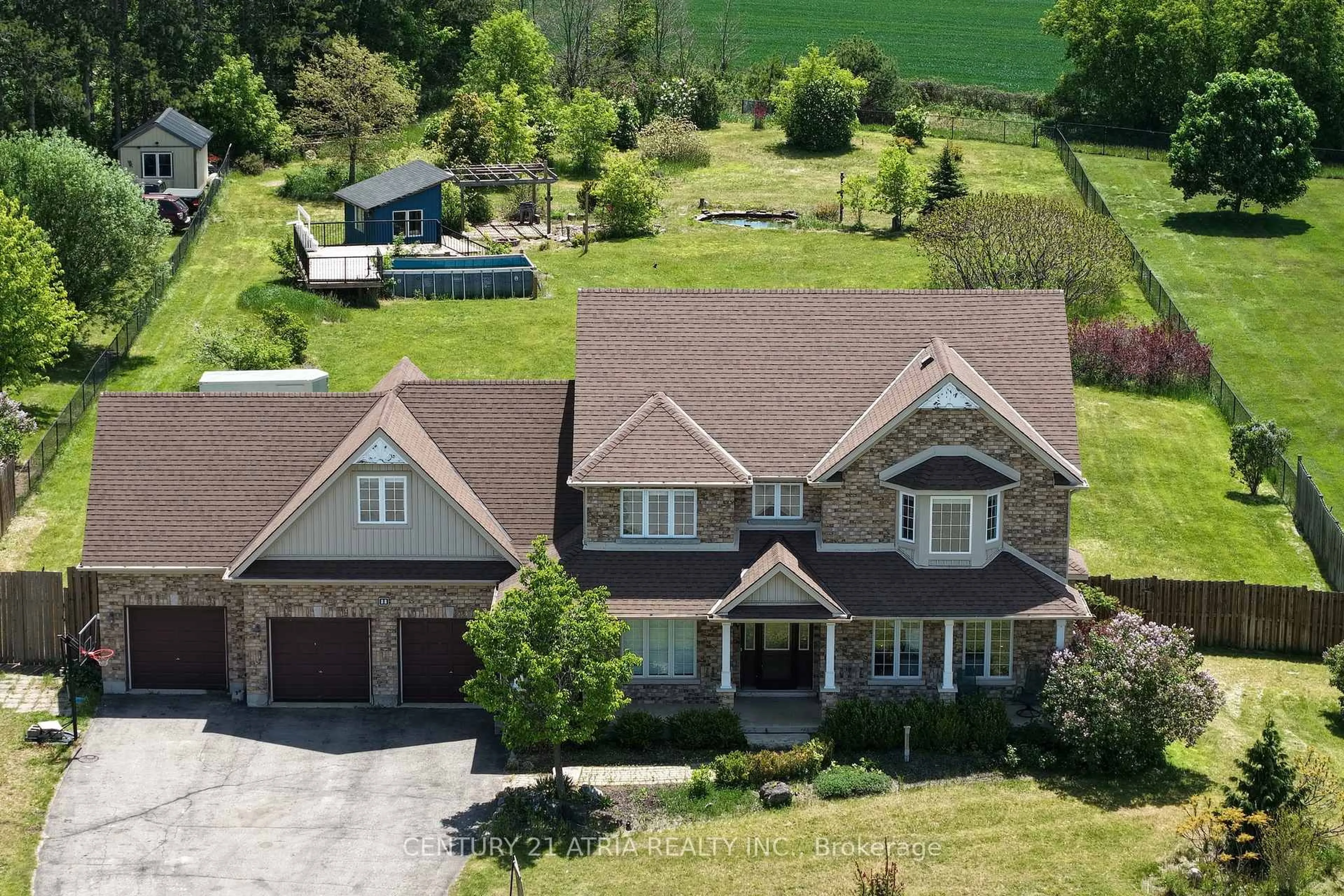 A pic from outside/outdoor area/front of a property/back of a property/a pic from drone, mountain view for 11 Jeffery Dr, Mulmur Ontario L9V 3H7