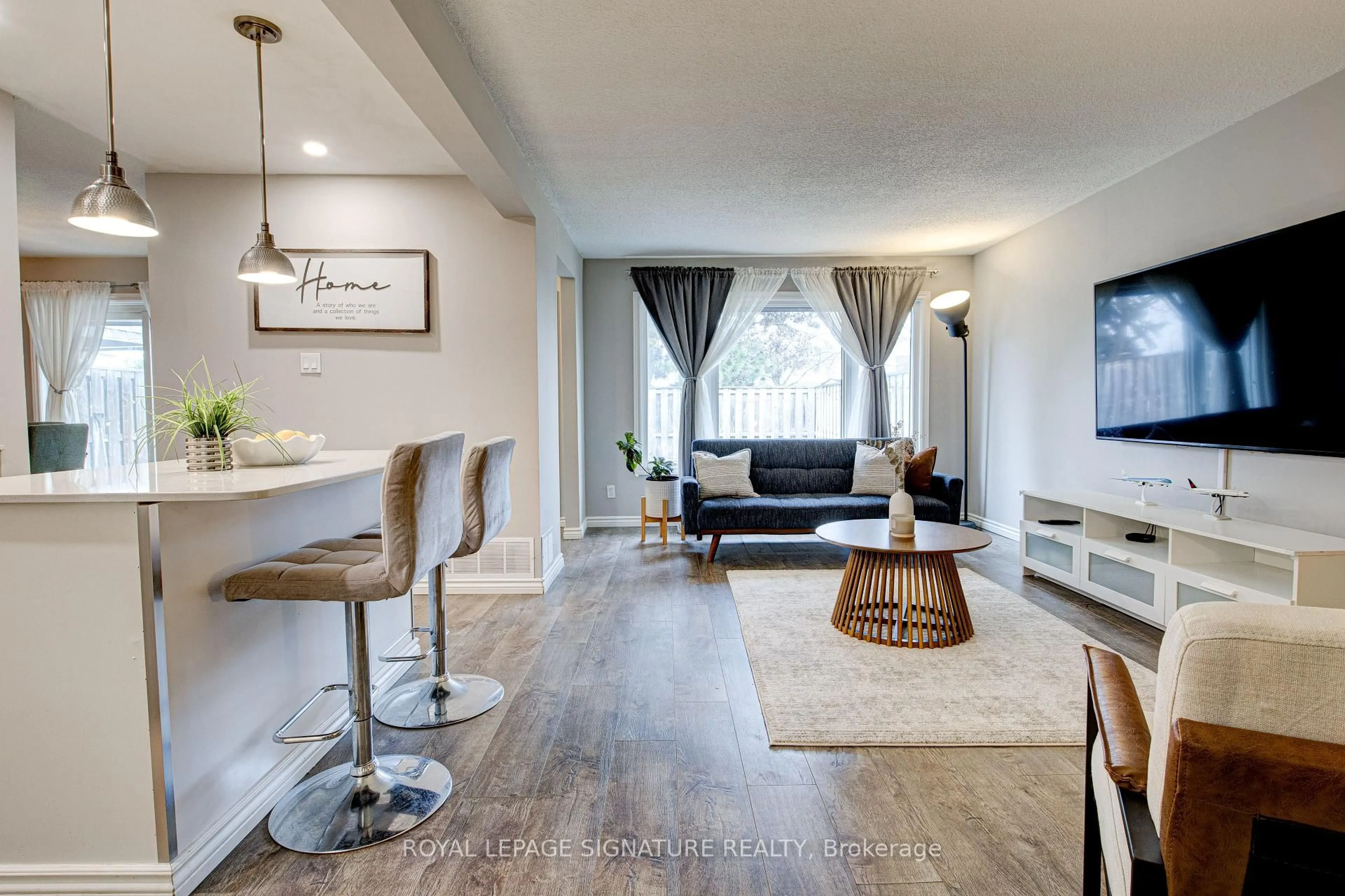 Living room with furniture, wood/laminate floor for 14 Williamsburg Rd #12, Kitchener Ontario N2E 1W1