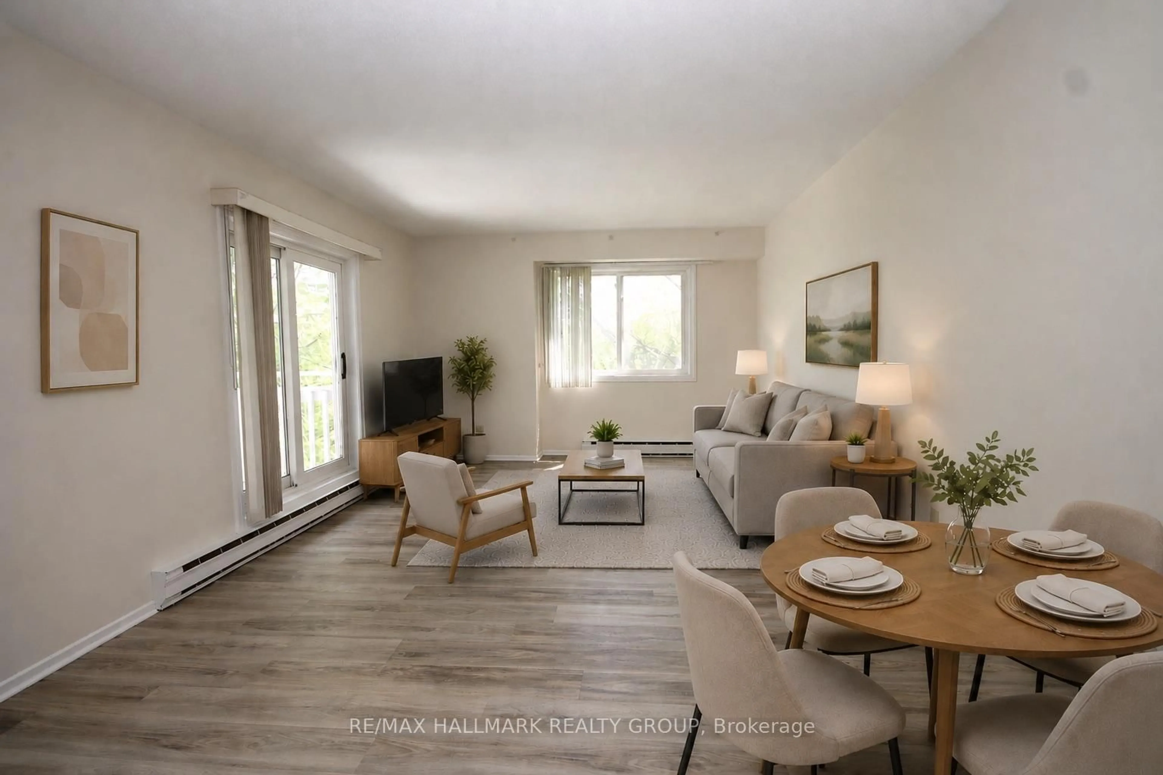 Living room with furniture, wood/laminate floor for 268 Lorry Greenberg Dr #311, Ottawa Ontario K1T 3K1