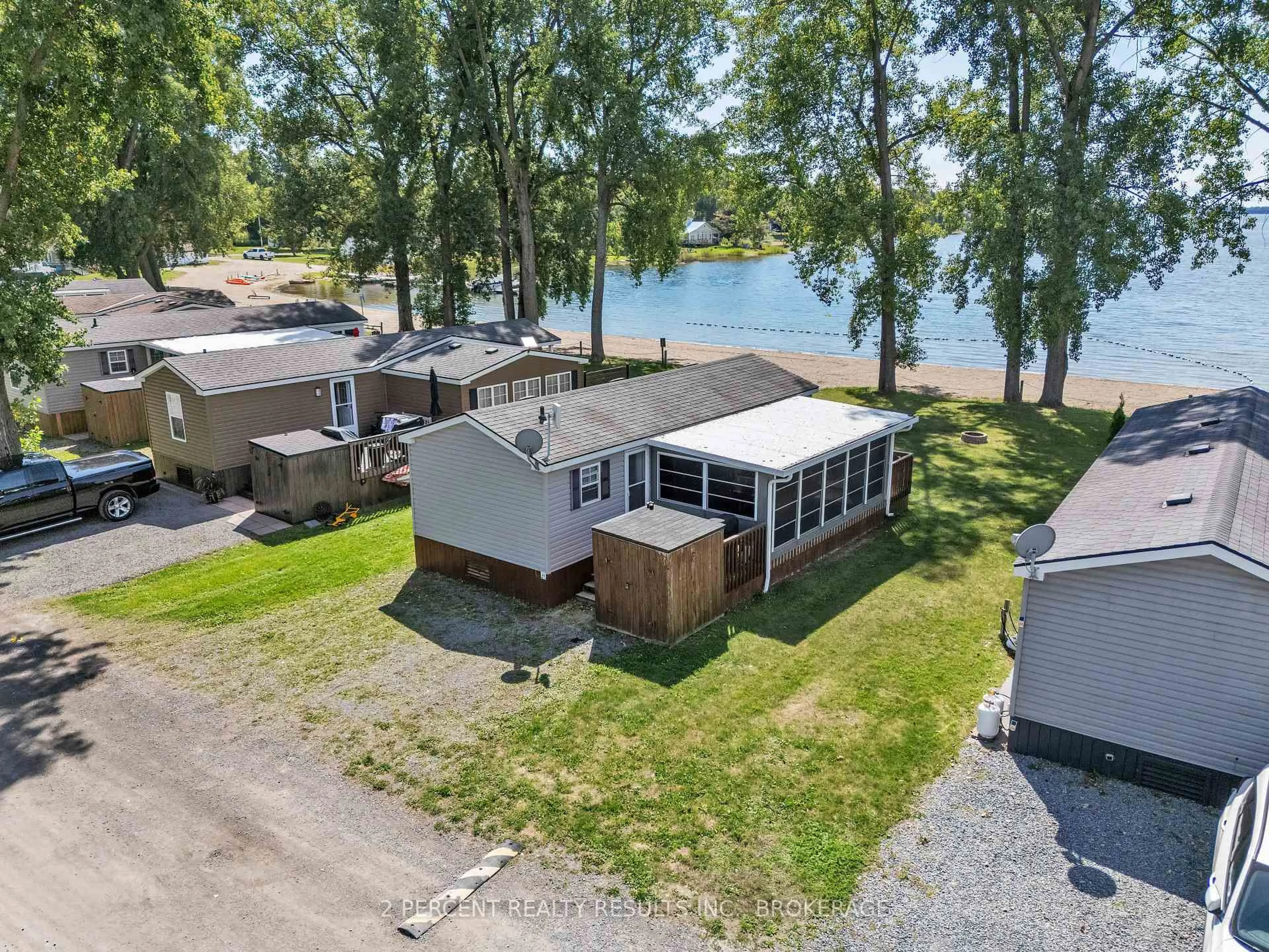 A pic from outside/outdoor area/front of a property/back of a property/a pic from drone, water/lake/river/ocean view for 486 County Road 18 Rd #BVL023, Prince Edward County Ontario K0K 1P0