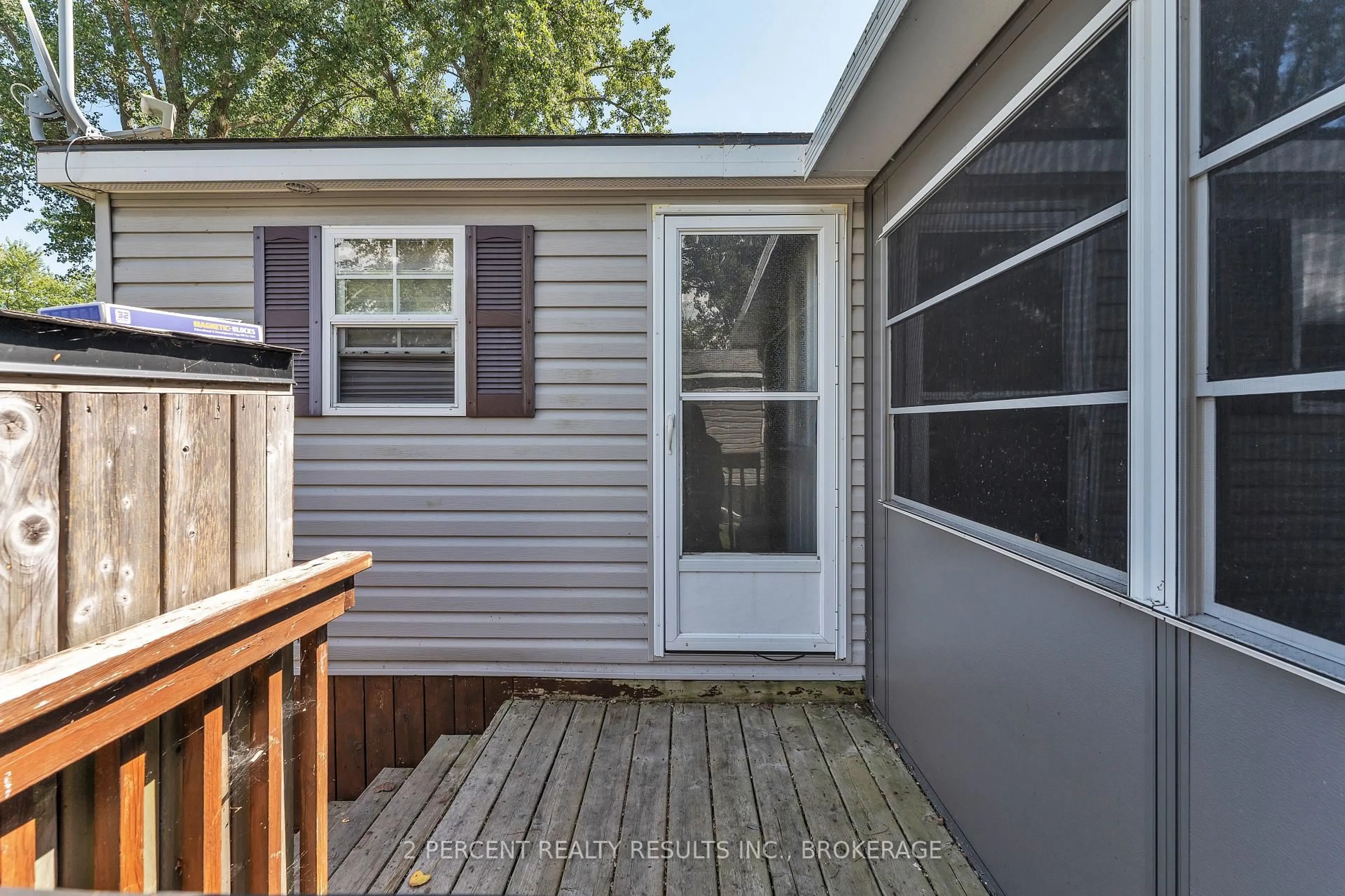 Home with vinyl exterior material, street for 486 County Road 18 Rd #BVL023, Prince Edward County Ontario K0K 1P0