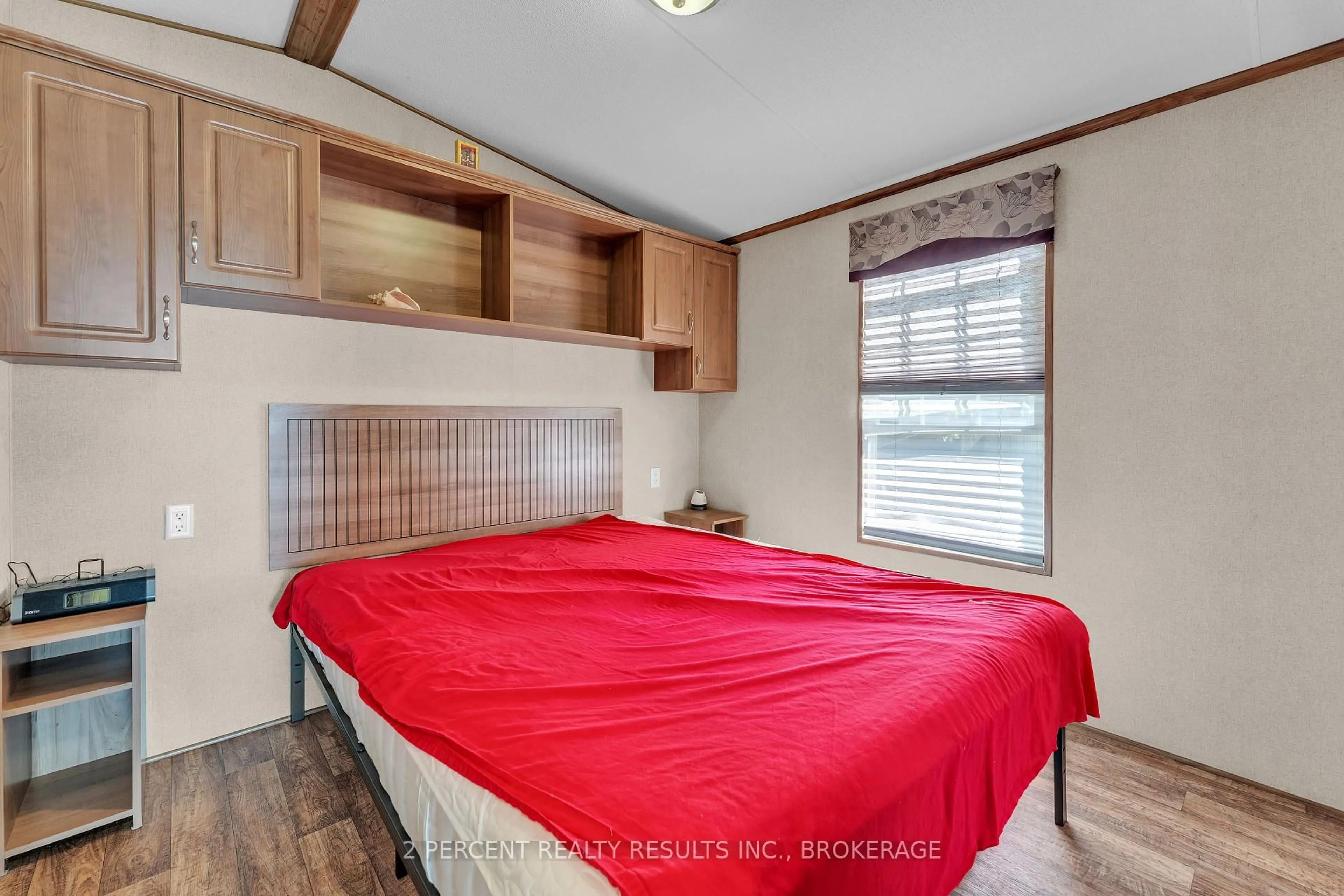 Bedroom with bed, wood/laminate floor for 486 County Road 18 Rd #BVL023, Prince Edward County Ontario K0K 1P0