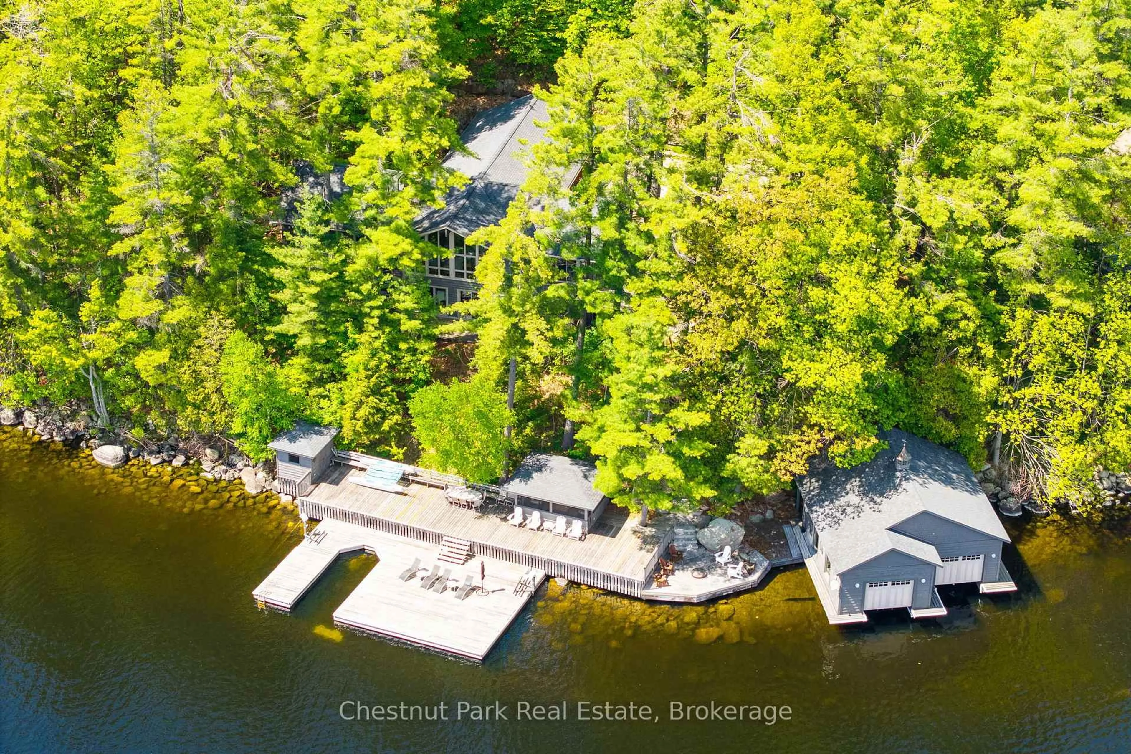 A pic from outside/outdoor area/front of a property/back of a property/a pic from drone, water/lake/river/ocean view for 1050 Trillium Dr, Bracebridge Ontario P1L 1X1