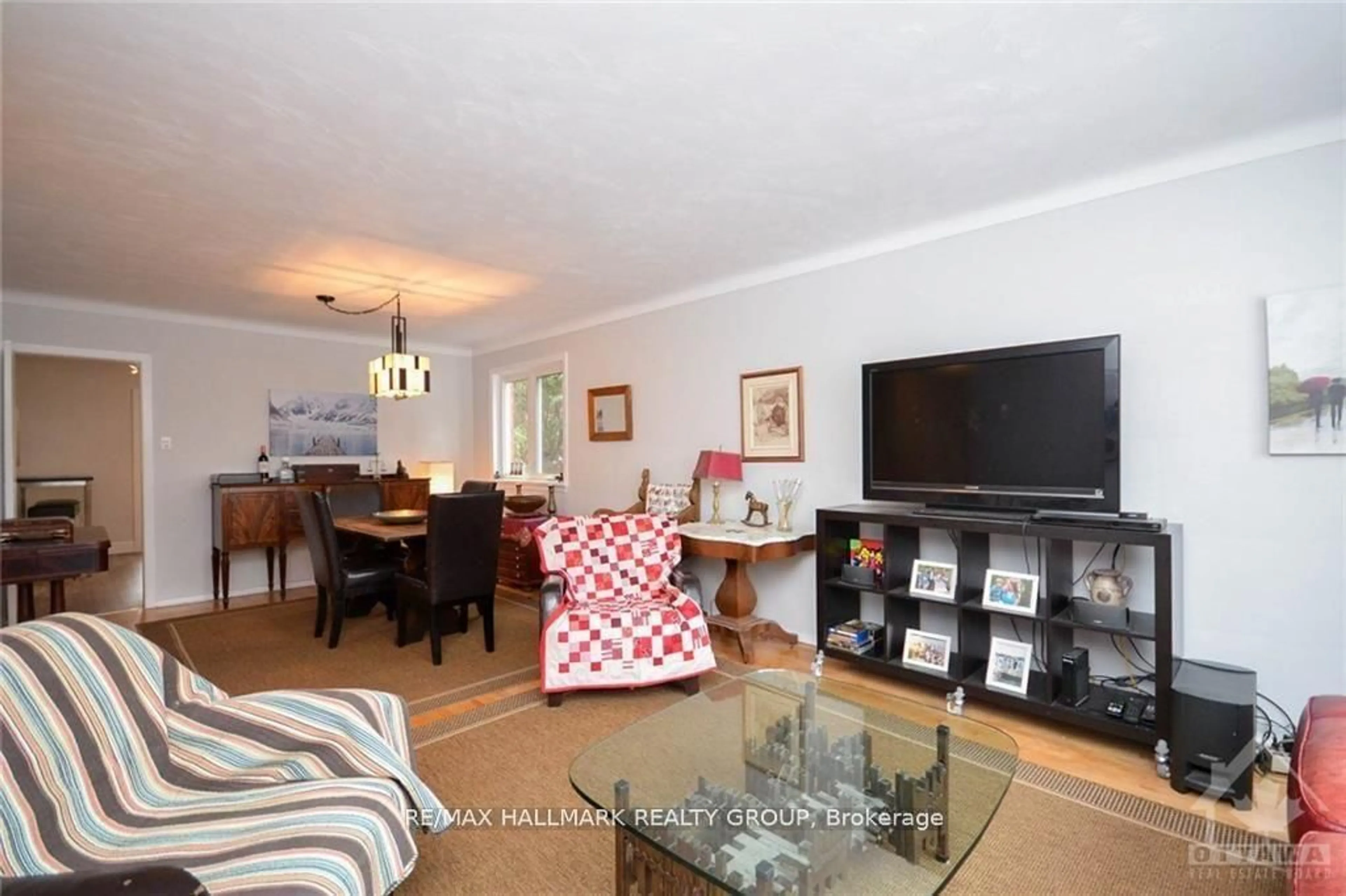 Living room with furniture, wood/laminate floor for 657 Golden Ave, Ottawa Ontario K2A 2G3