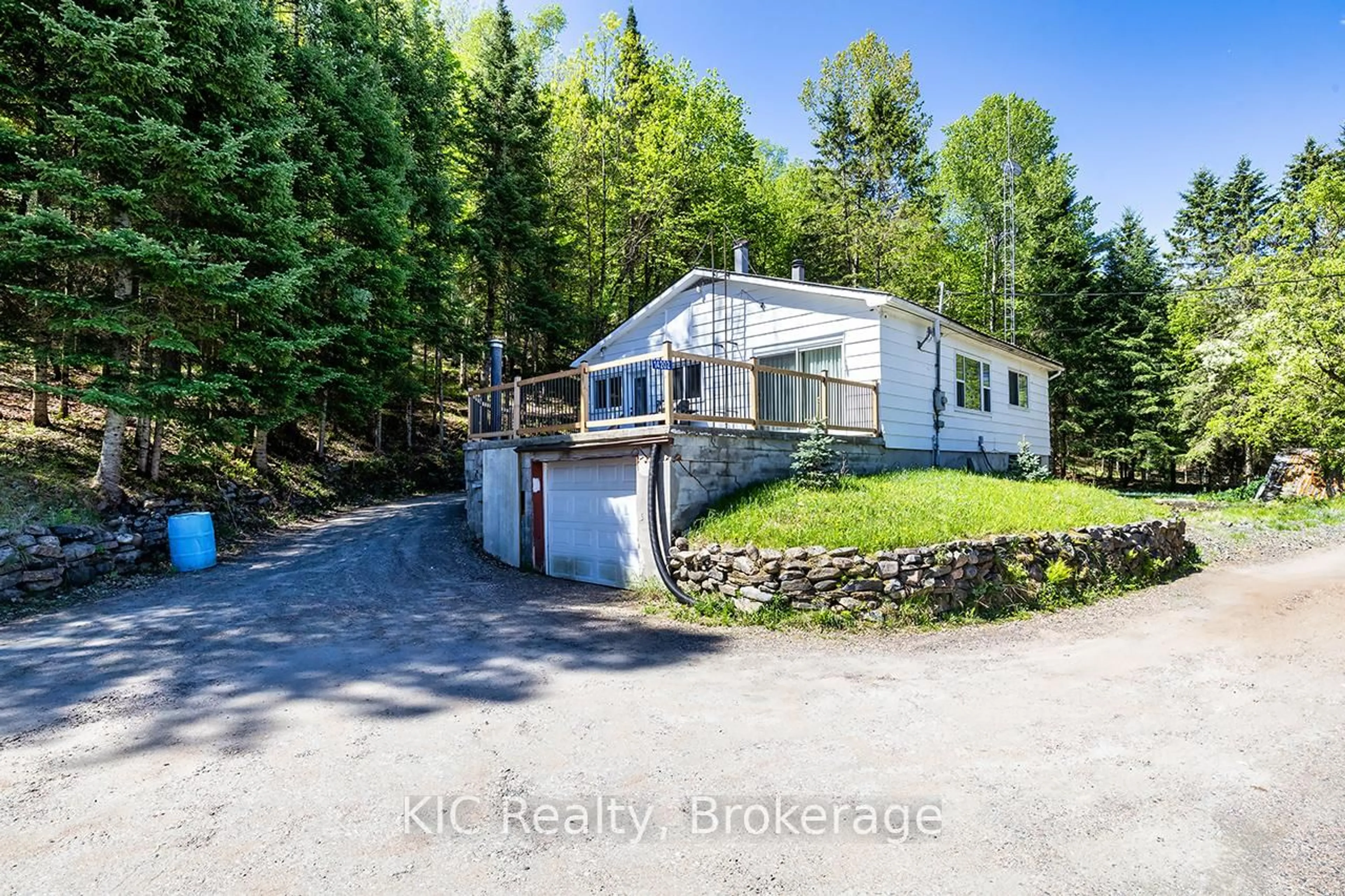A pic from outside/outdoor area/front of a property/back of a property/a pic from drone, water/lake/river/ocean view for 14202 Highway 118 Highway, Dysart et al Ontario K0M 1S0