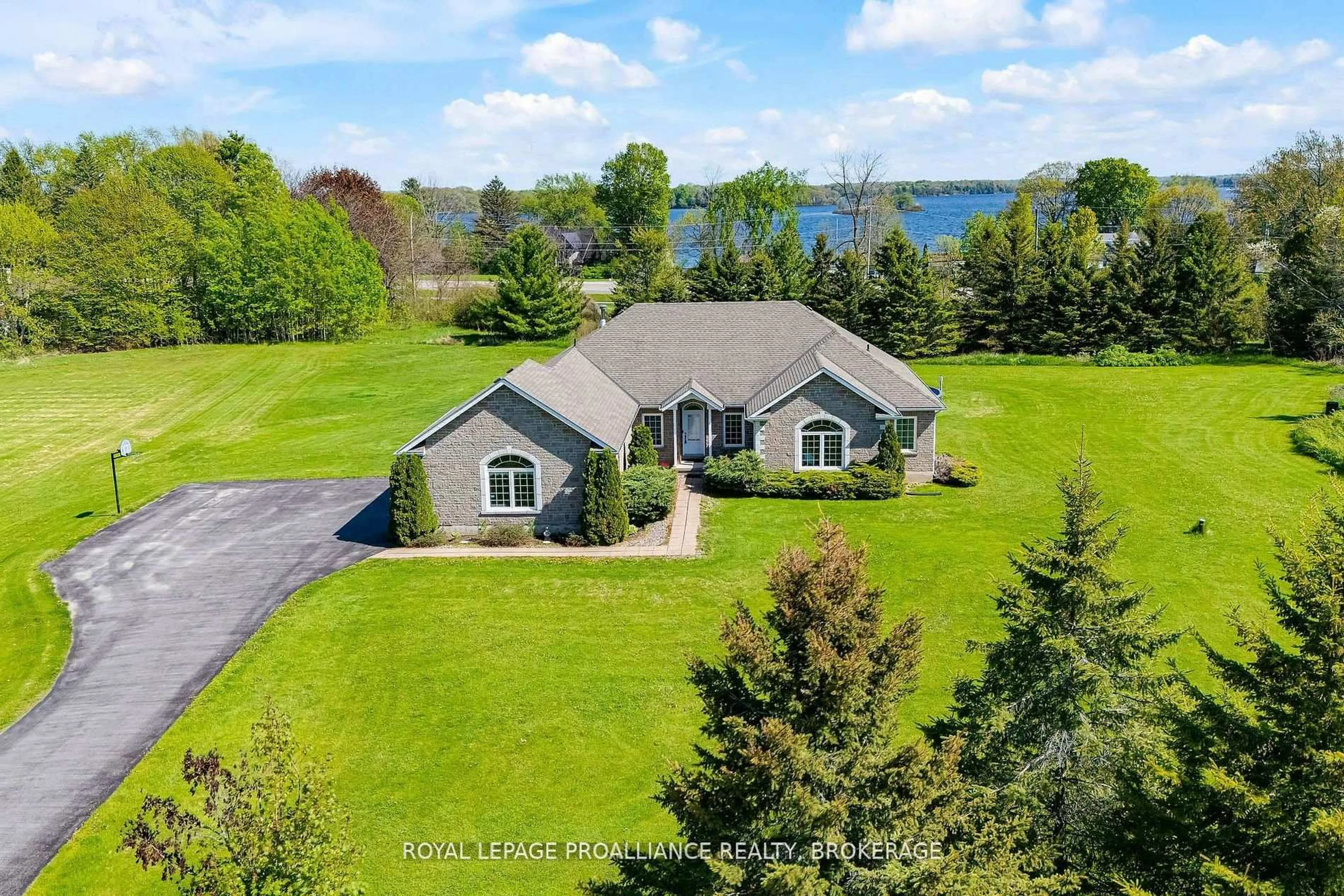 A pic from outside/outdoor area/front of a property/back of a property/a pic from drone, water/lake/river/ocean view for 61 Conner Dr, Gananoque Ontario K7G 2V4