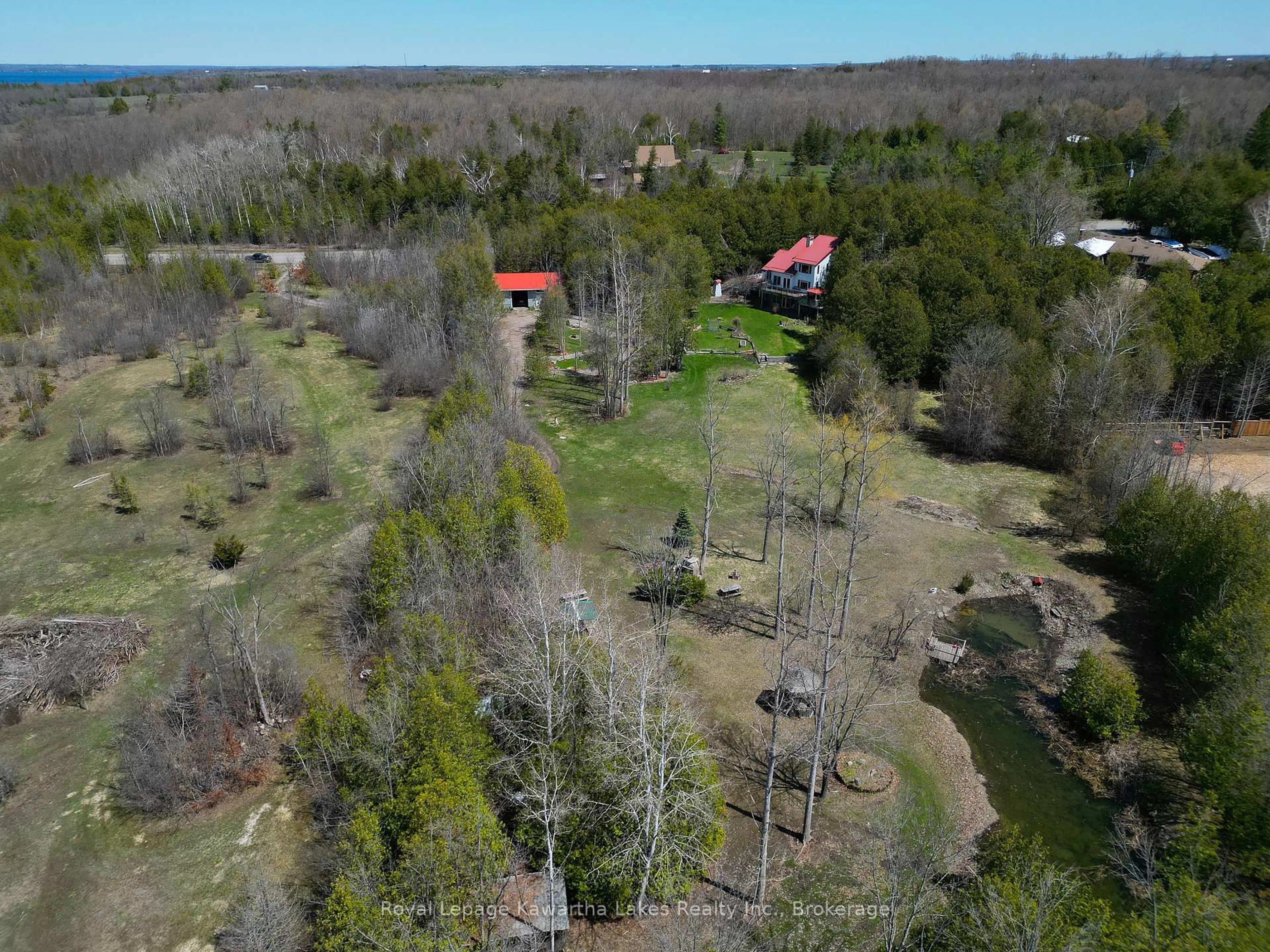 A pic from outside/outdoor area/front of a property/back of a property/a pic from drone, forest/trees view for 153 Pleasant Point Rd, Kawartha Lakes Ontario K9V 4R6