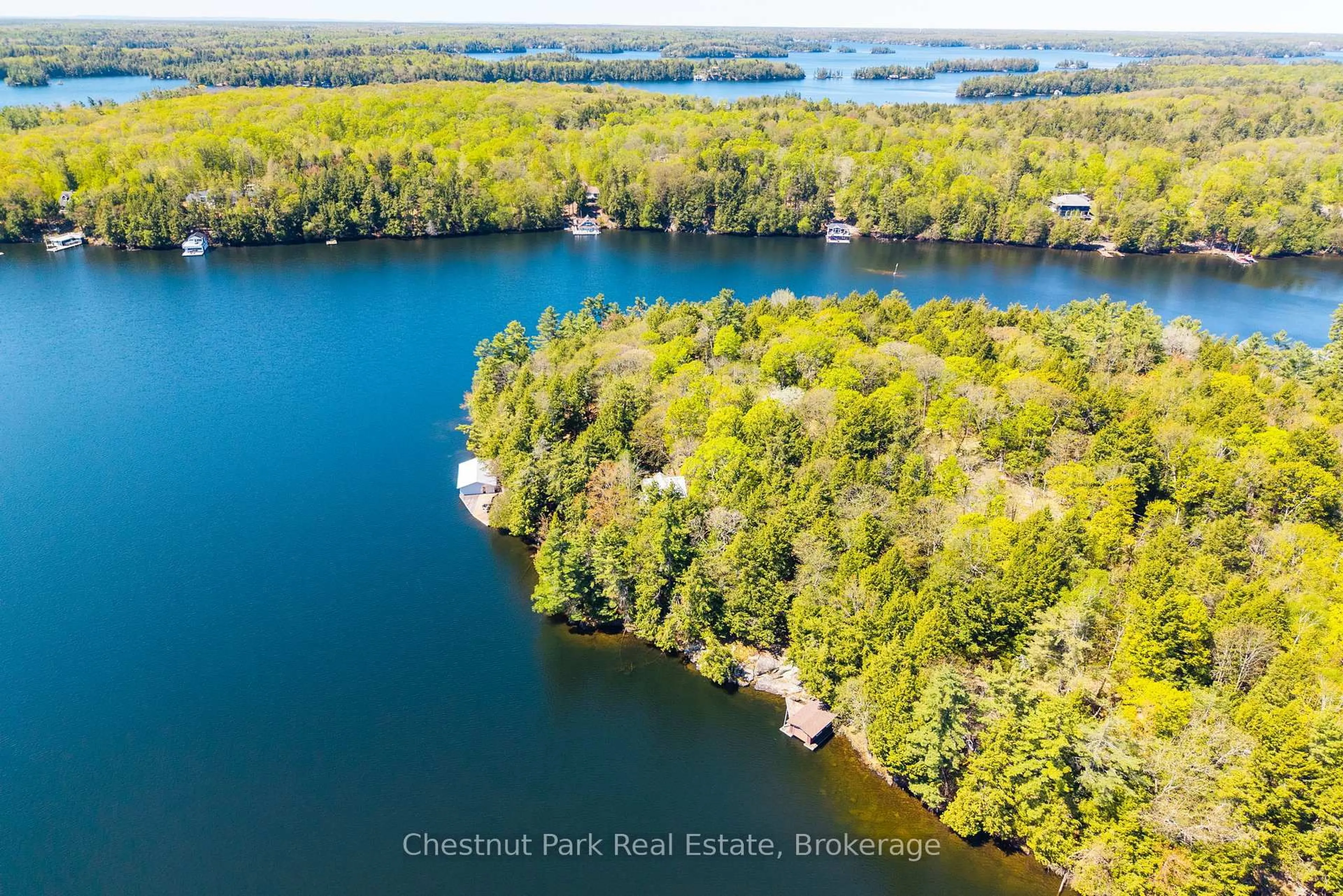A pic from outside/outdoor area/front of a property/back of a property/a pic from drone, water/lake/river/ocean view for 1901 Peninsula Rd #21, Muskoka Lakes Ontario P0B 1J0