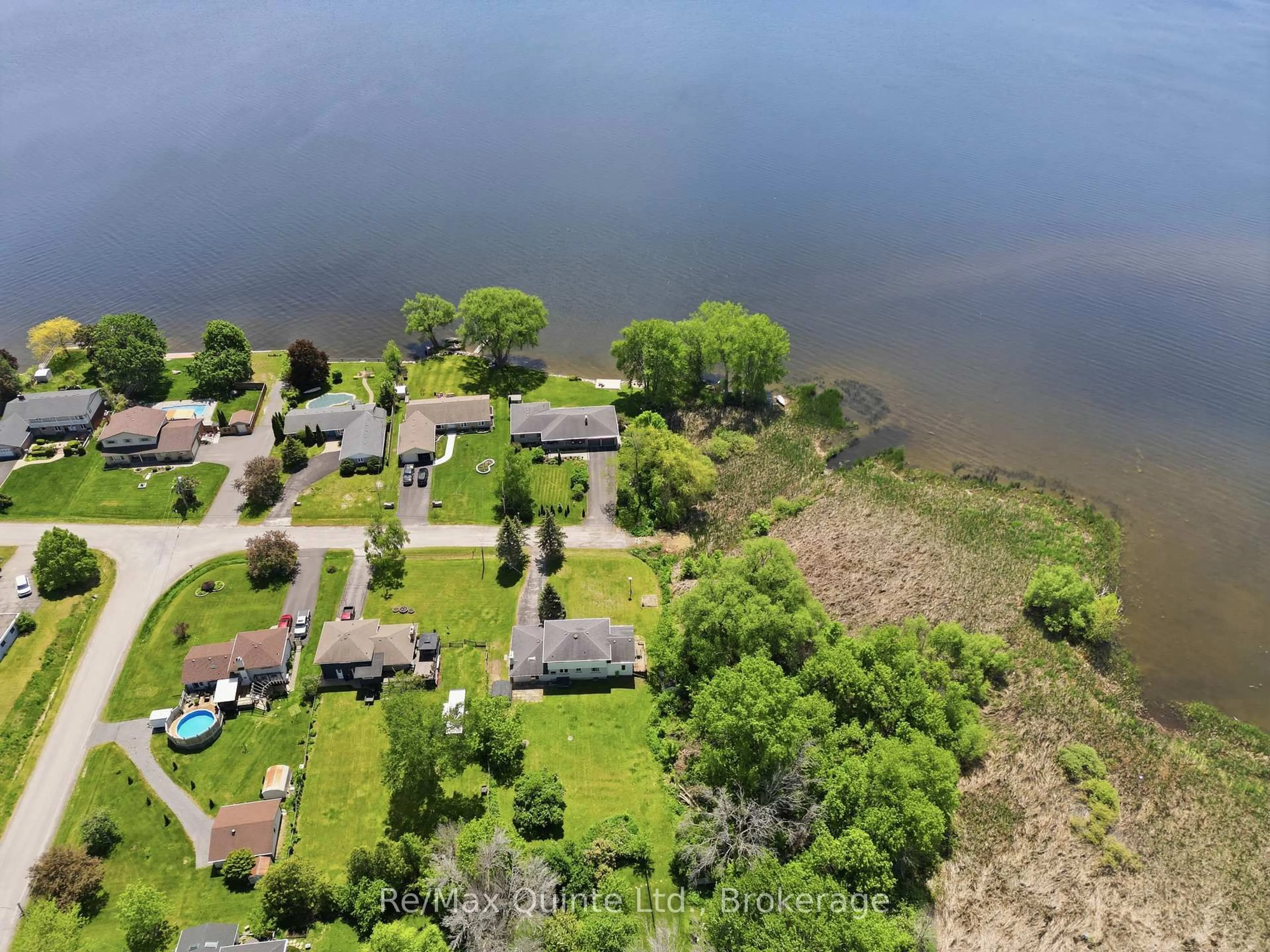 A pic from outside/outdoor area/front of a property/back of a property/a pic from drone, water/lake/river/ocean view for 106 Baylea Dr, Quinte West Ontario K8V 5P5