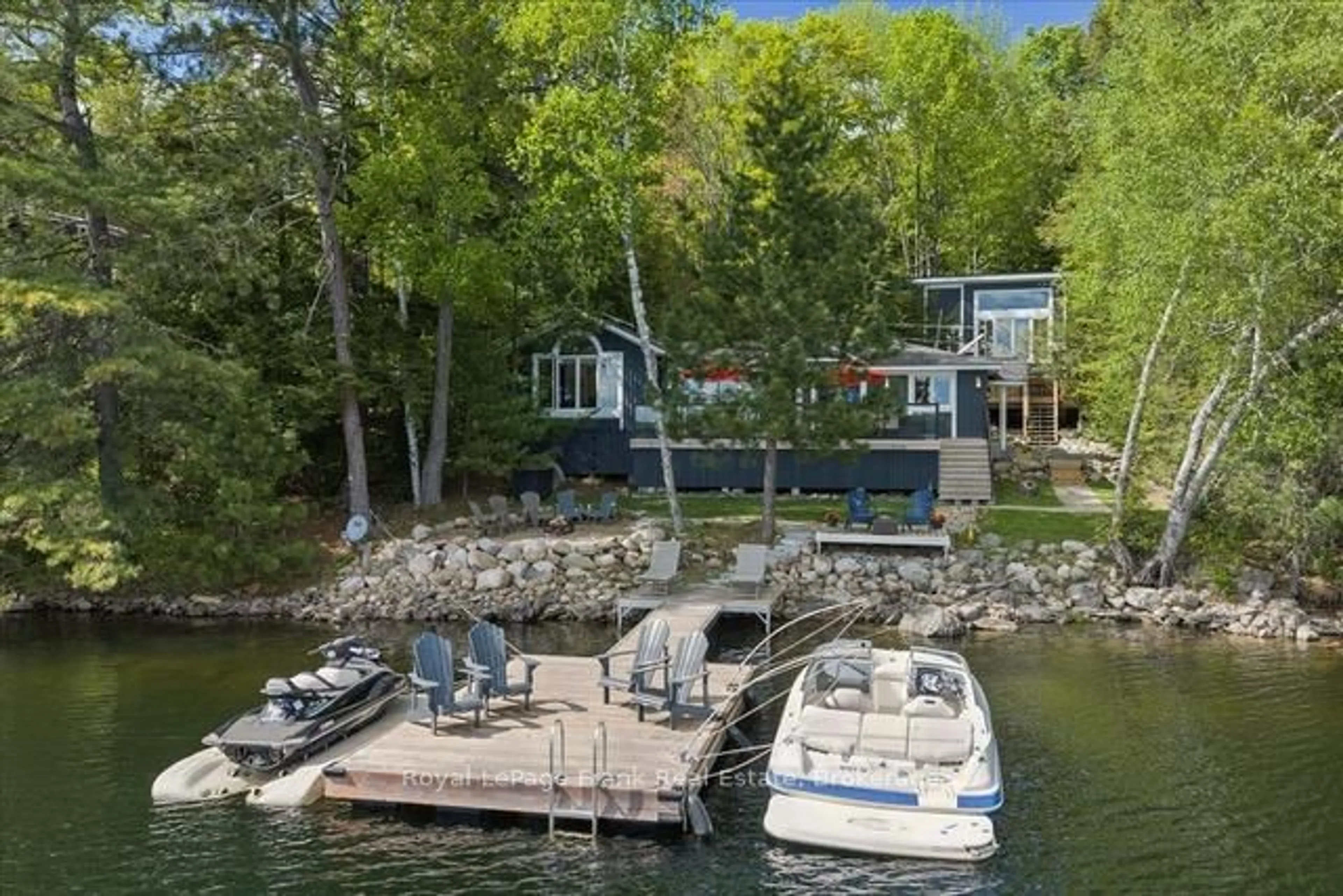 A pic from outside/outdoor area/front of a property/back of a property/a pic from drone, water/lake/river/ocean view for 5639 Kennisis Lake Rd, Dysart et al Ontario K0M 1S0