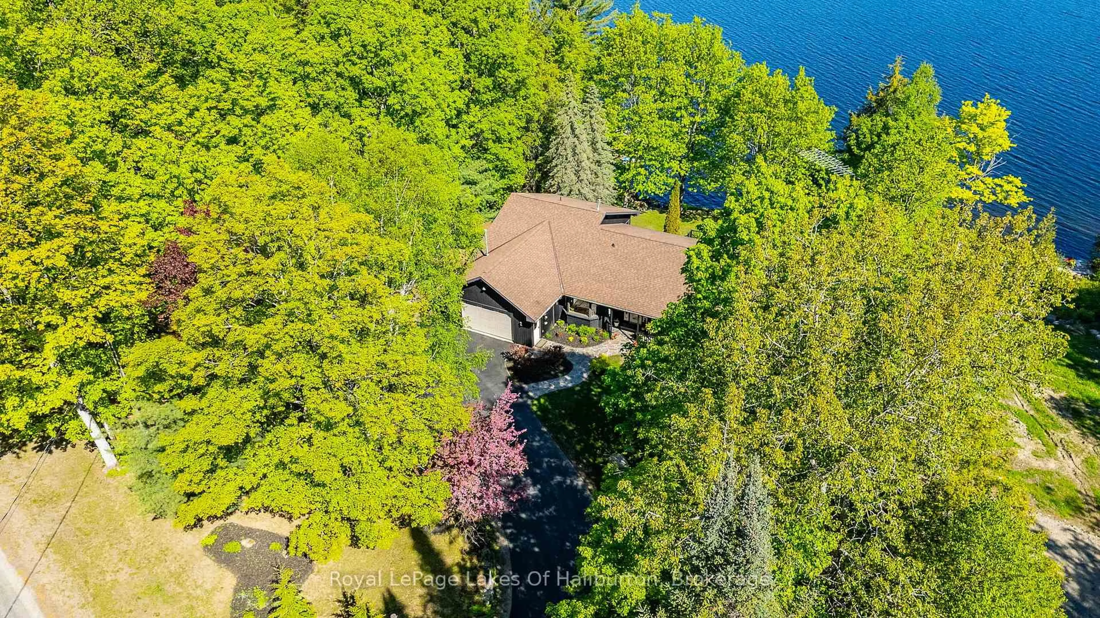 A pic from outside/outdoor area/front of a property/back of a property/a pic from drone, water/lake/river/ocean view for 2697 Kashagawigamog Lake Rd, Dysart et al Ontario K0M 1S0