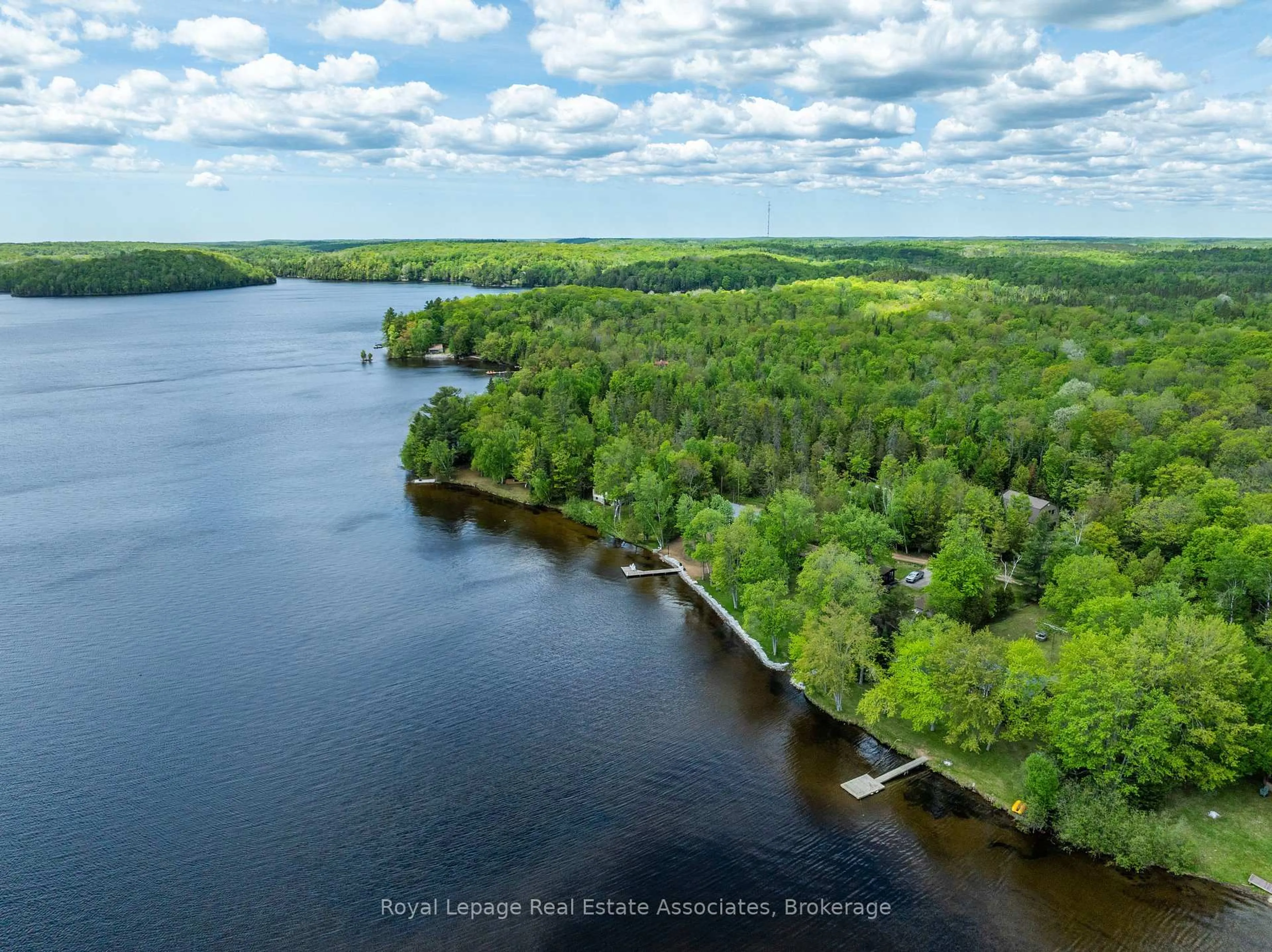 A pic from outside/outdoor area/front of a property/back of a property/a pic from drone, water/lake/river/ocean view for 243 Beach Lane, Coe Hill Ontario K0L 1P0