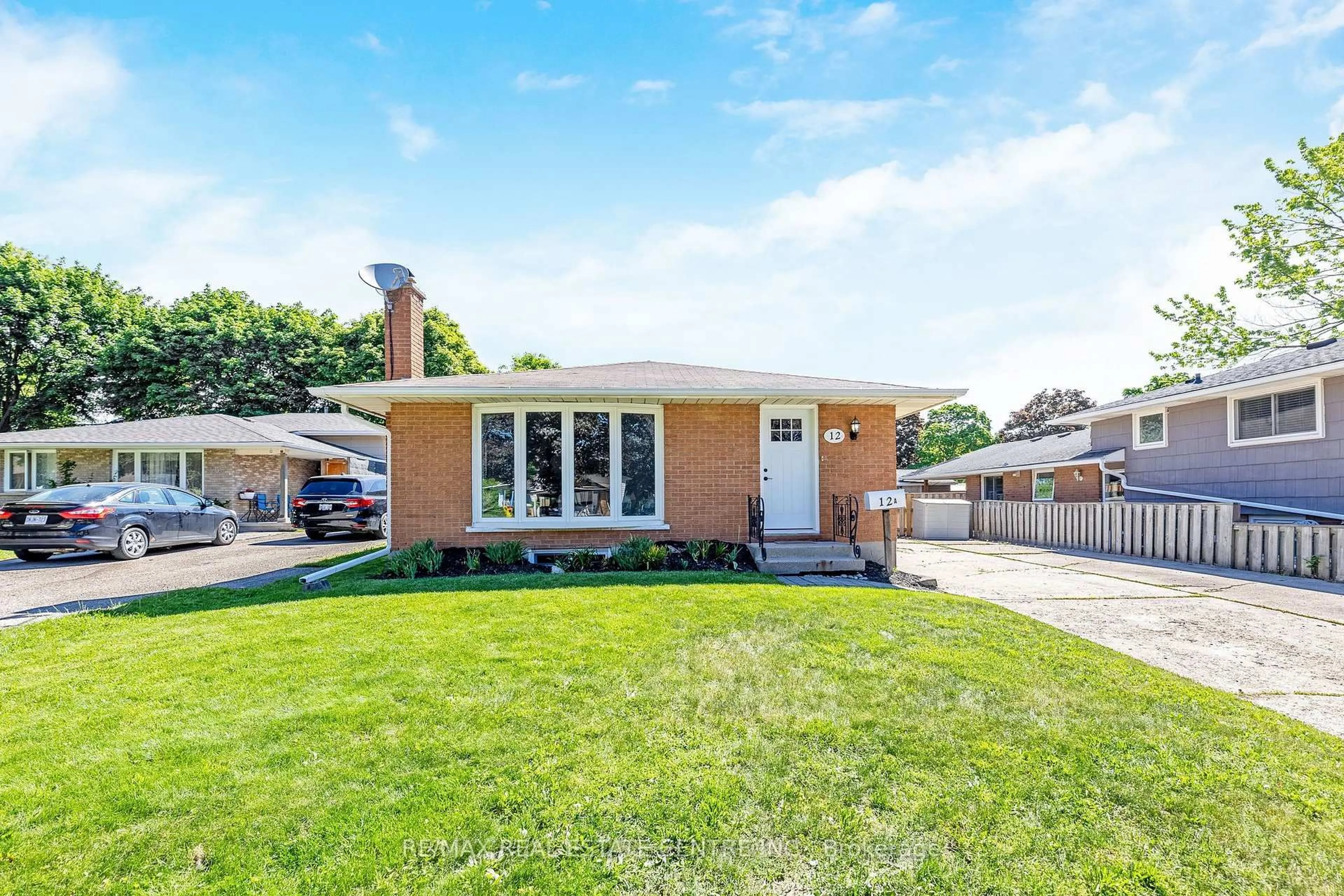 Home with brick exterior material, street for 12 Selkirk Crt, Kitchener Ontario N2E 1M3