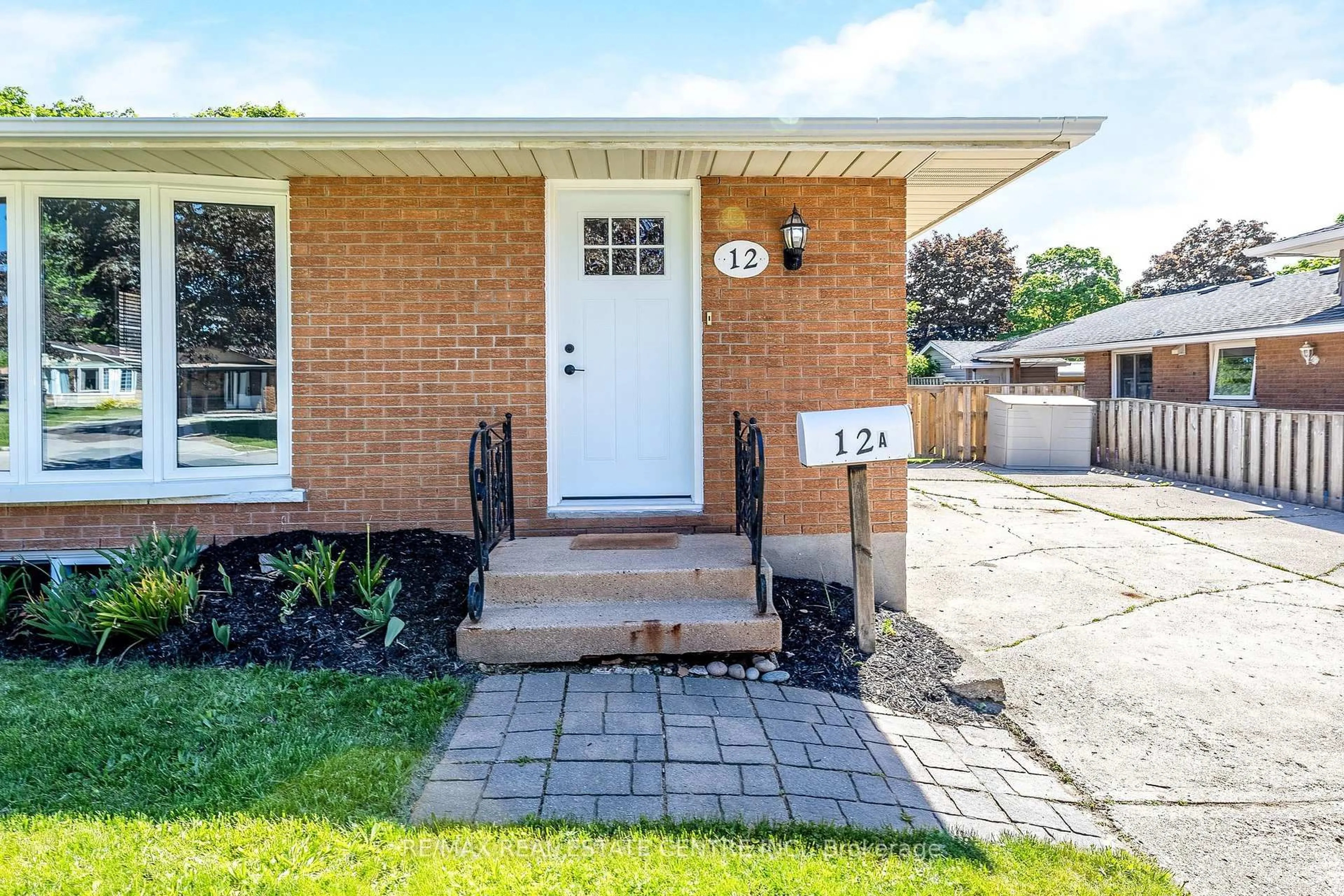Home with brick exterior material, street for 12 Selkirk Crt, Kitchener Ontario N2E 1M3