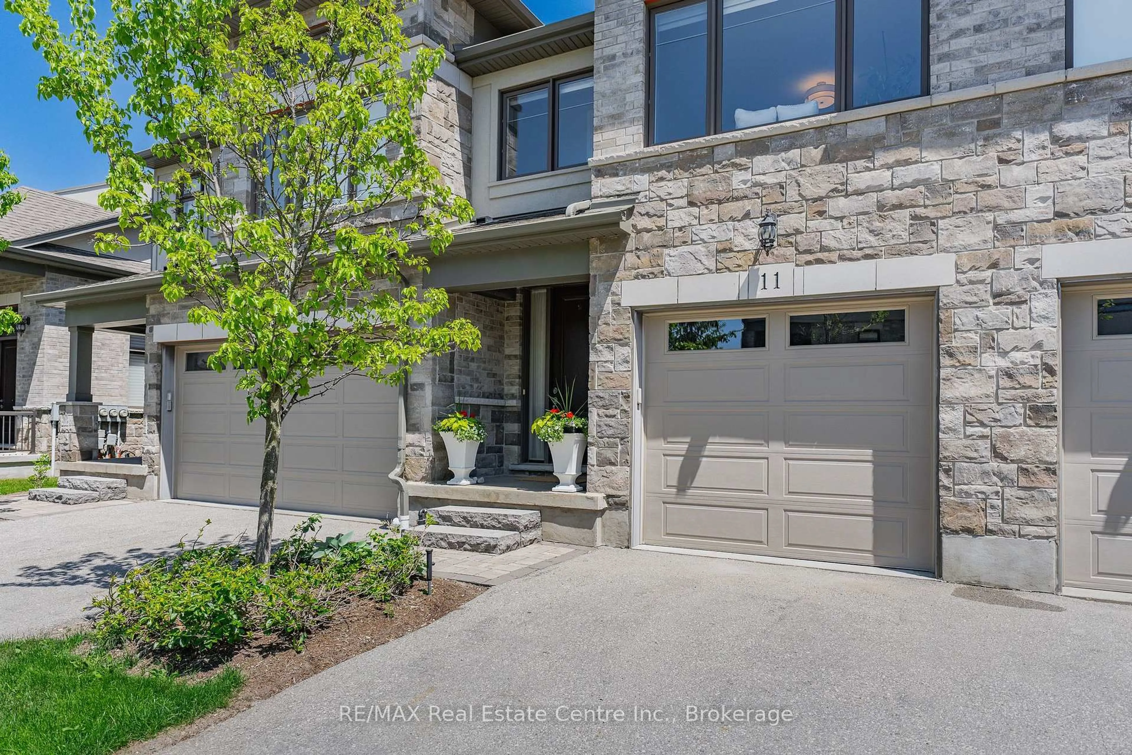 Home with brick exterior material, street for 243 Grey Silo Rd #11, Waterloo Ontario N2K 0B9