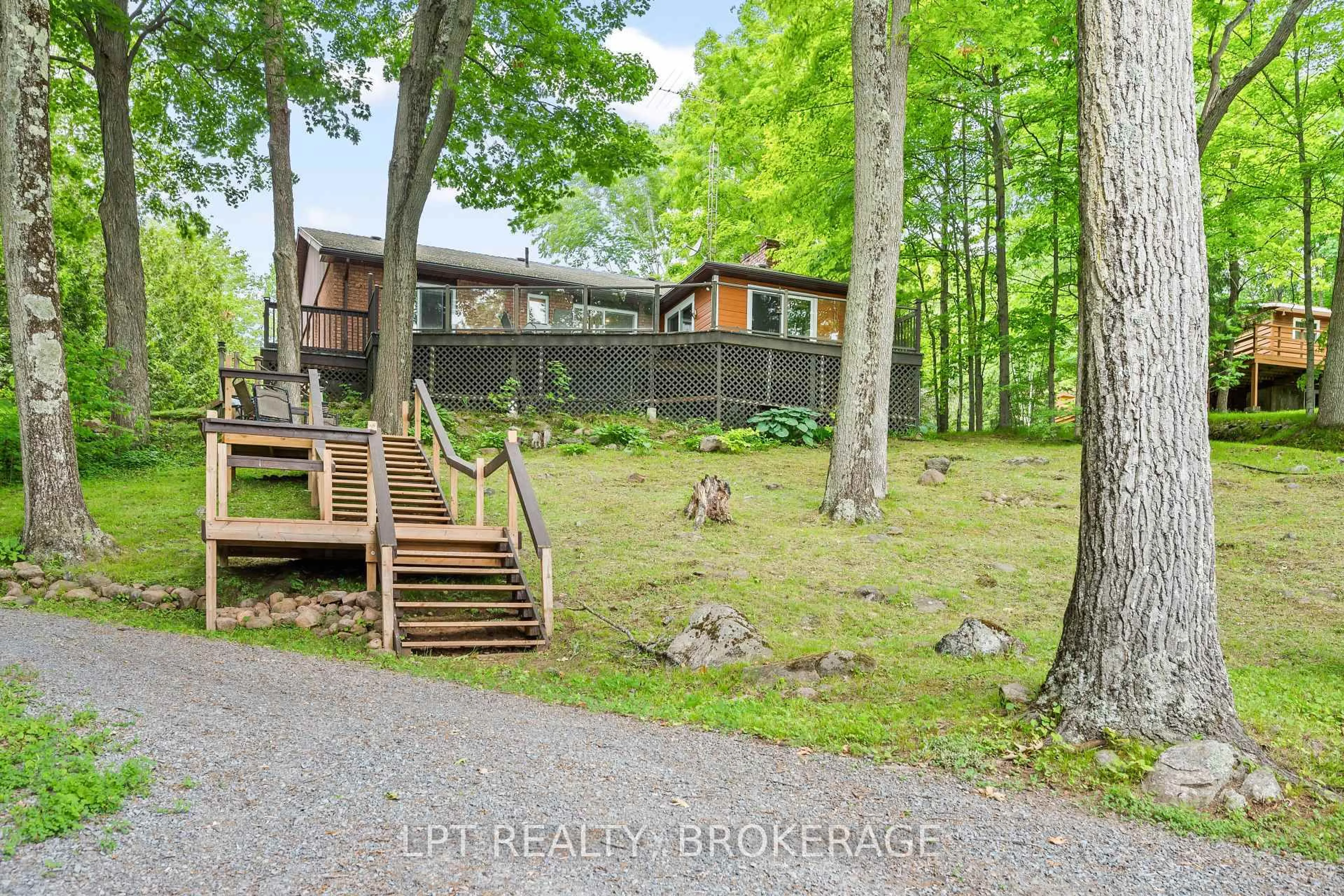 A pic from outside/outdoor area/front of a property/back of a property/a pic from drone, forest/trees view for 31 Acorn Lane, Tichborne Ontario K0H 2V0