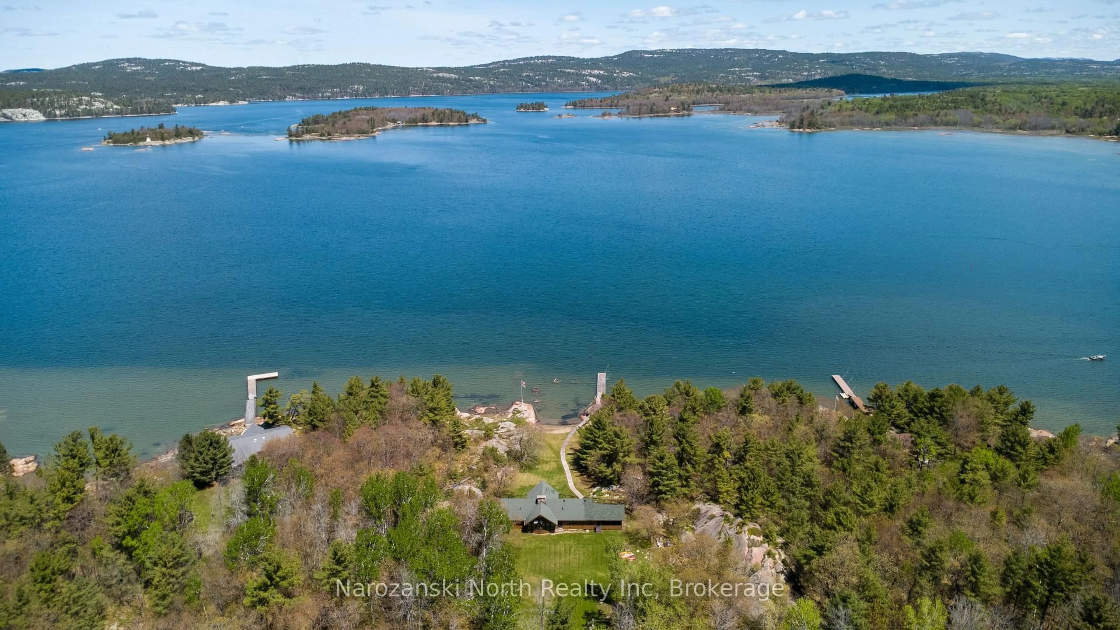 A pic from outside/outdoor area/front of a property/back of a property/a pic from drone, water/lake/river/ocean view for 774 George Island, Killarney Ontario P0M 1A0