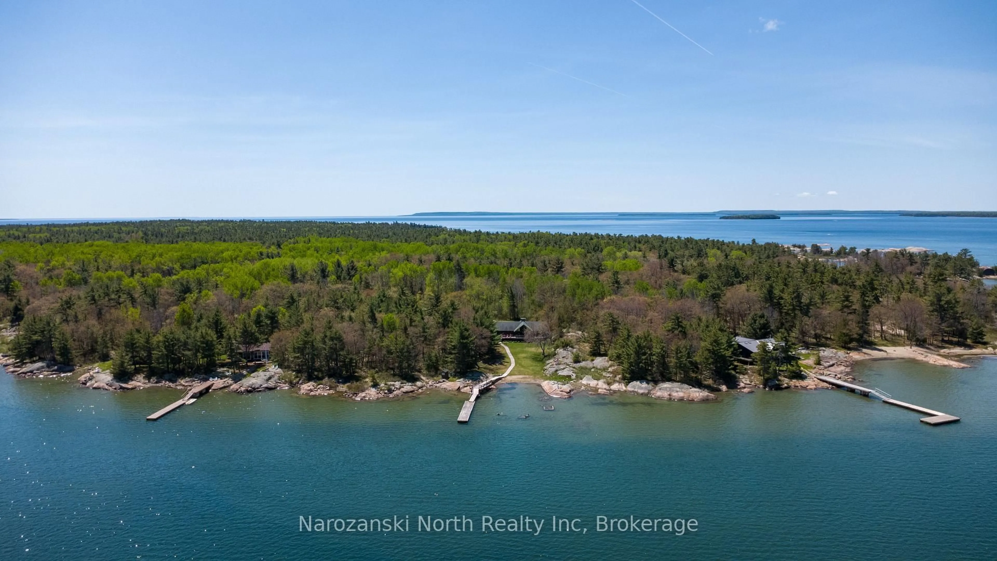 A pic from outside/outdoor area/front of a property/back of a property/a pic from drone, water/lake/river/ocean view for 774 George Island, Killarney Ontario P0M 1A0