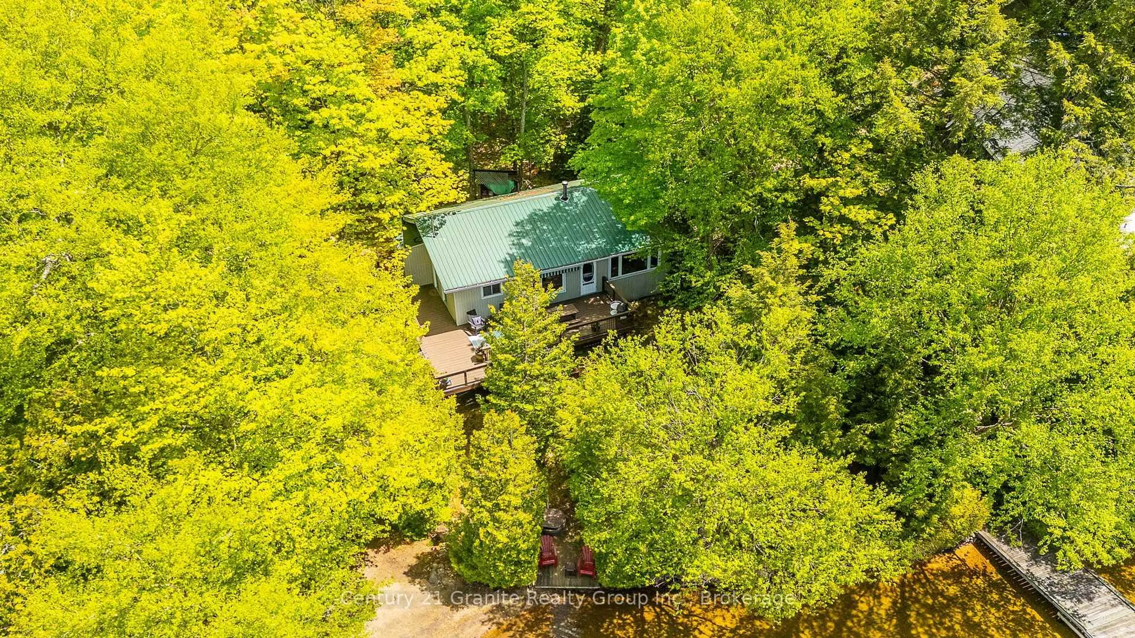 A pic from outside/outdoor area/front of a property/back of a property/a pic from drone, forest/trees view for 5195 Kennisis Lake Rd, Dysart et al Ontario K0M 1S0