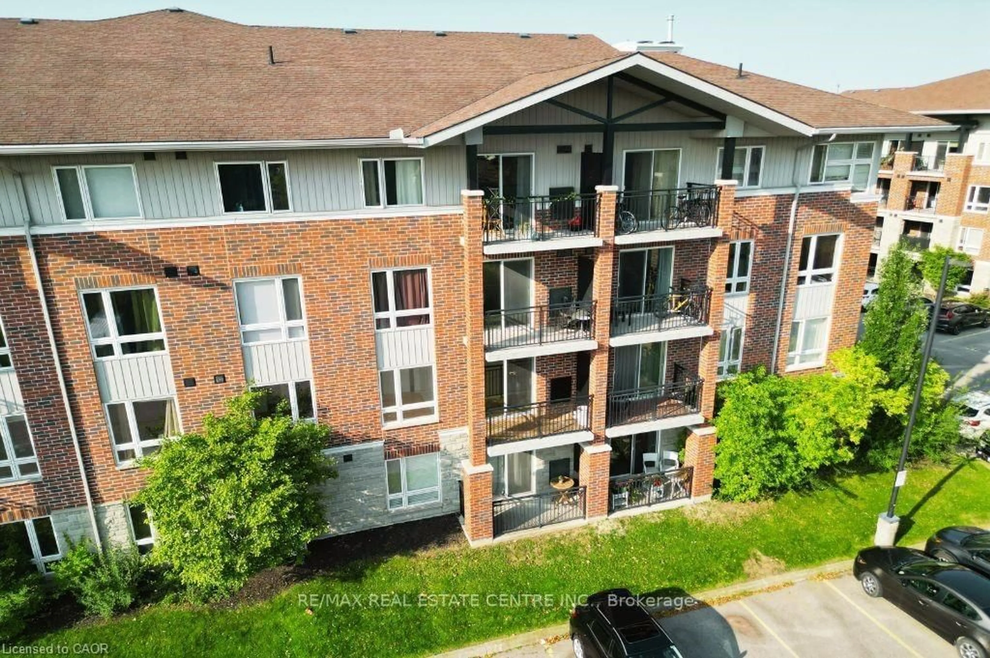 A pic from outside/outdoor area/front of a property/back of a property/a pic from drone, unknown for 41 Goodwin Dr #202, Guelph Ontario N1L 0E7