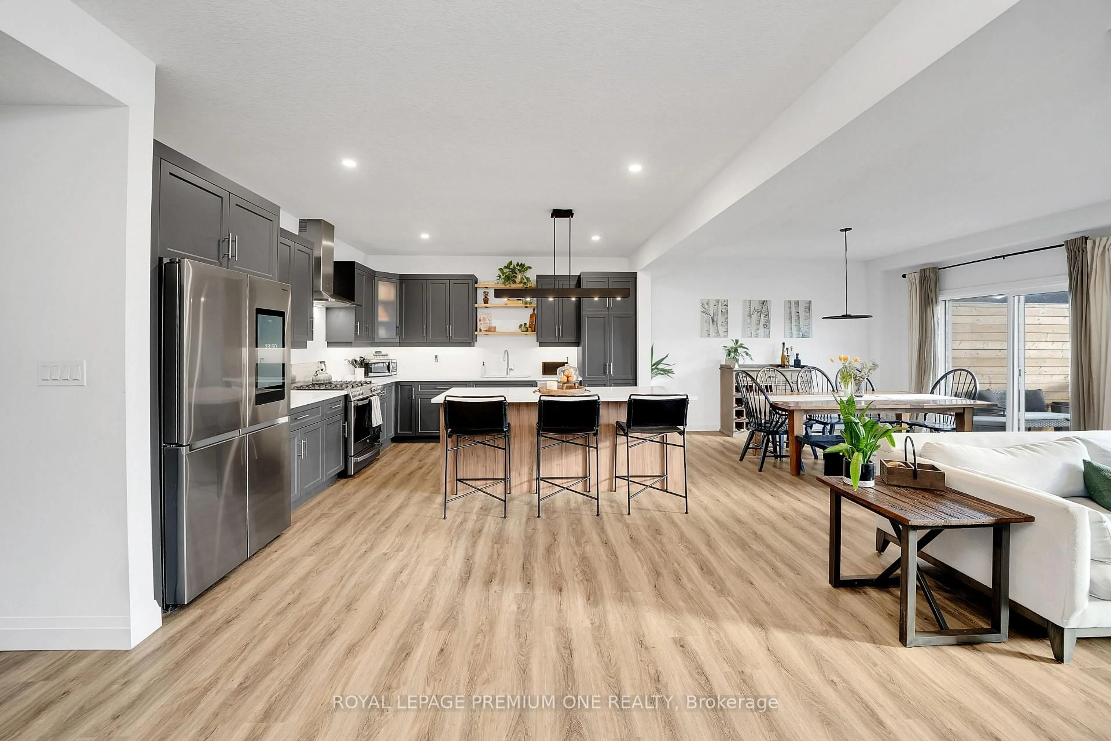 Open concept kitchen, wood/laminate floor for 207 Schmidt Dr, Wellington North Ontario N0G 1A0