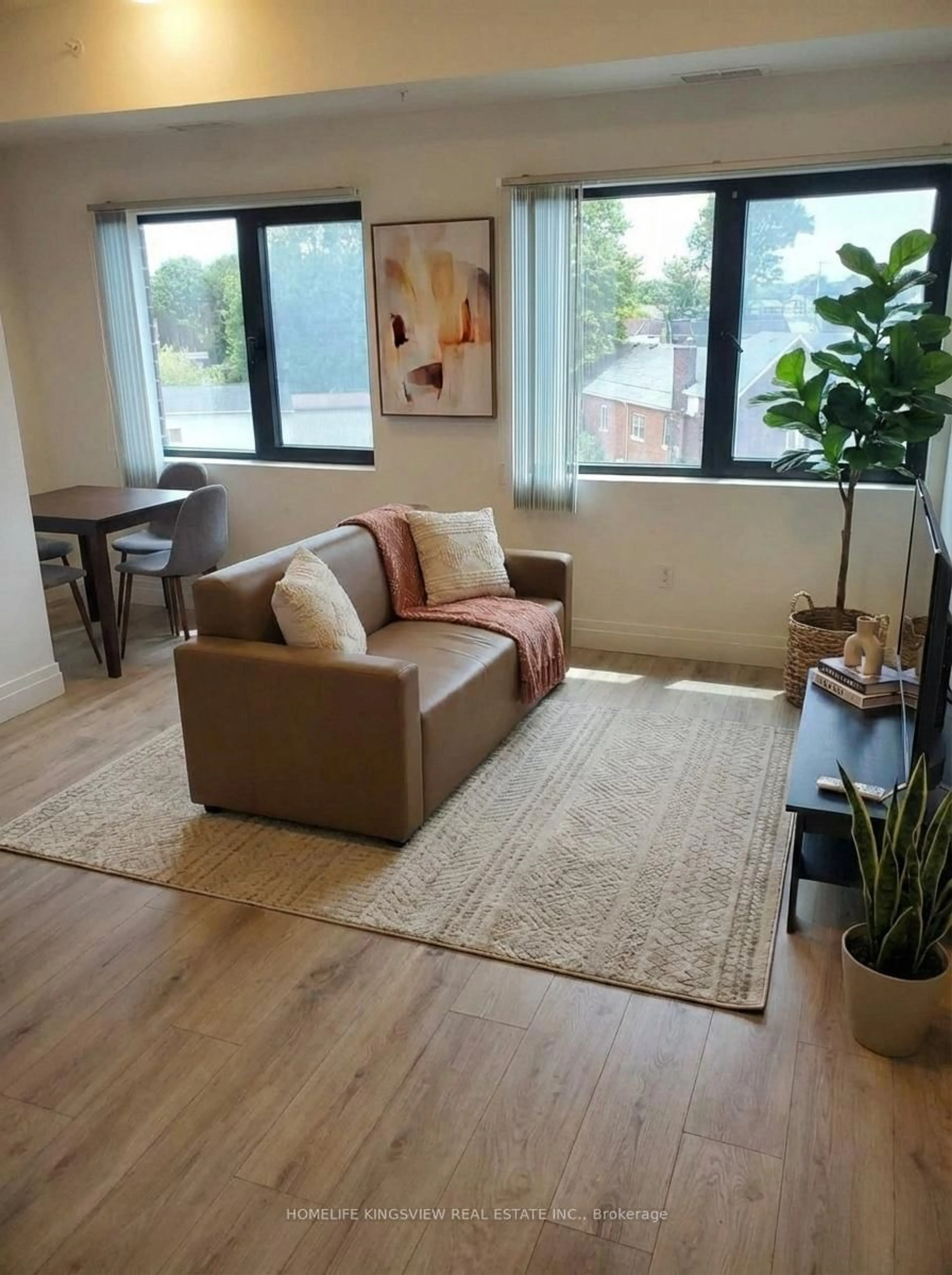 Living room with furniture, wood/laminate floor for 652 Princess St #425, Kingston Ontario K7L 1E5