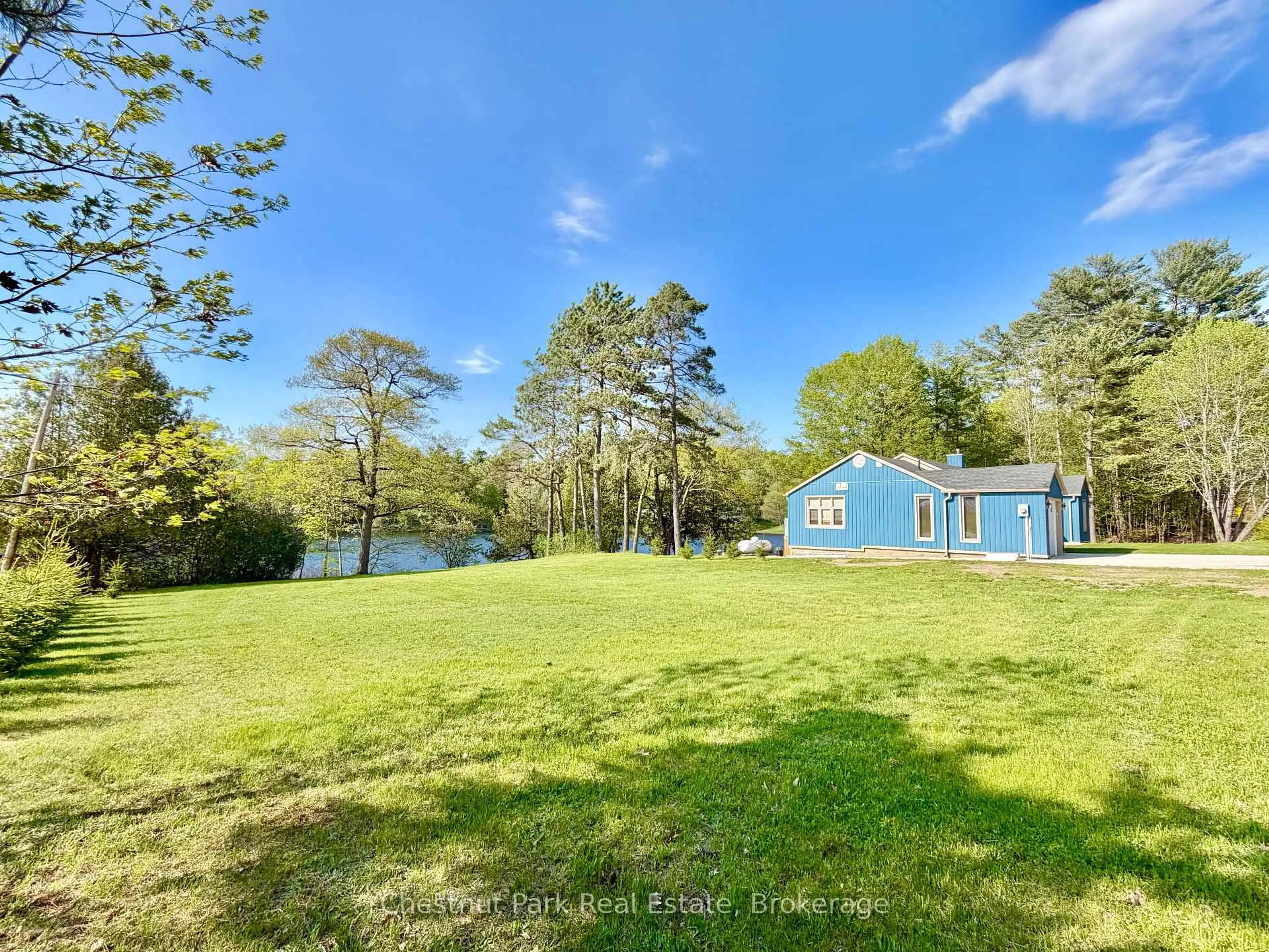 A pic from outside/outdoor area/front of a property/back of a property/a pic from drone, water/lake/river/ocean view for 9211 118 Highway, Minden Hills Ontario K0M 1S0