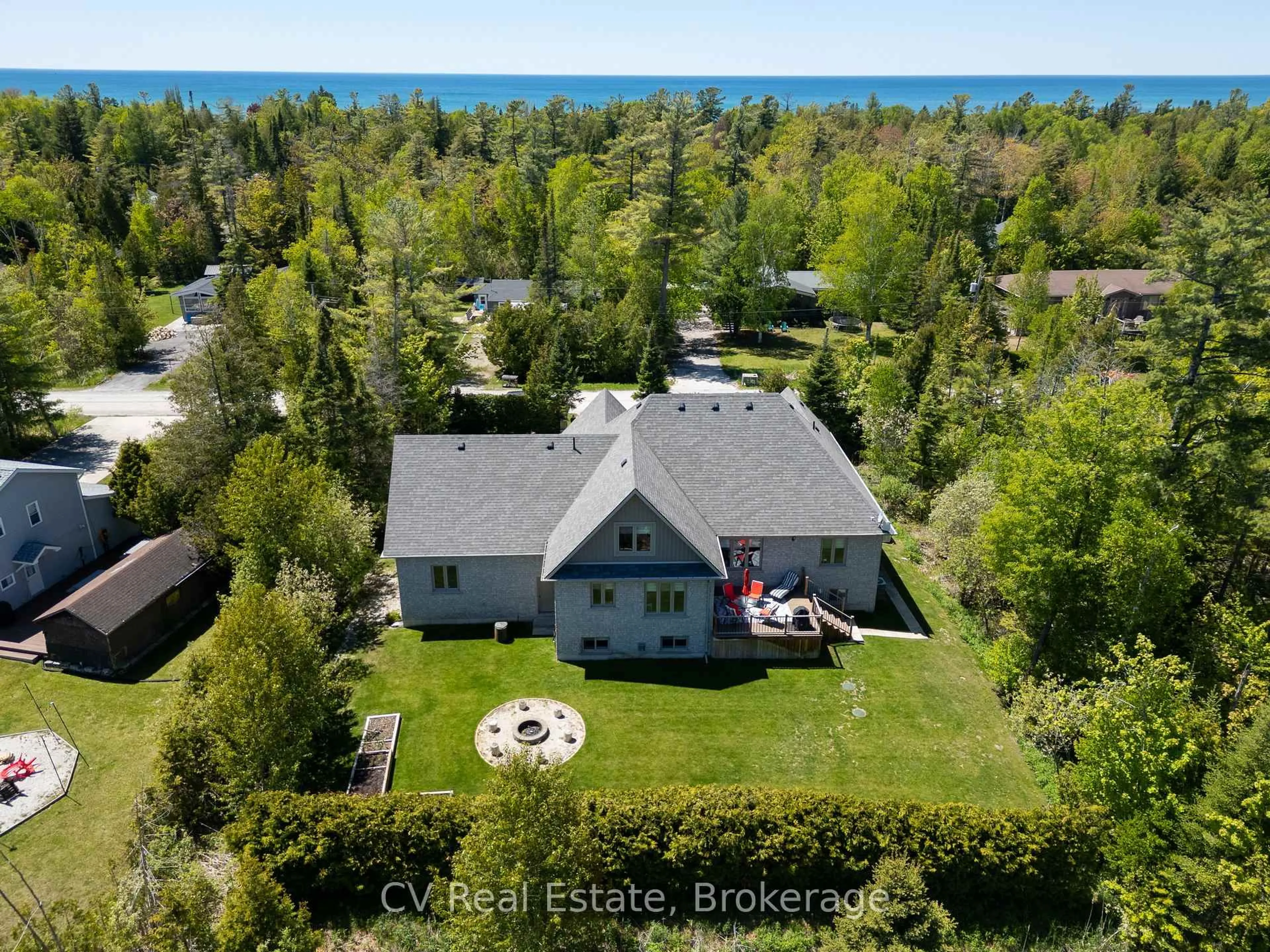 A pic from outside/outdoor area/front of a property/back of a property/a pic from drone, water/lake/river/ocean view for 180 St. Edmunds Cres, South Bruce Peninsula Ontario N0H 2G0