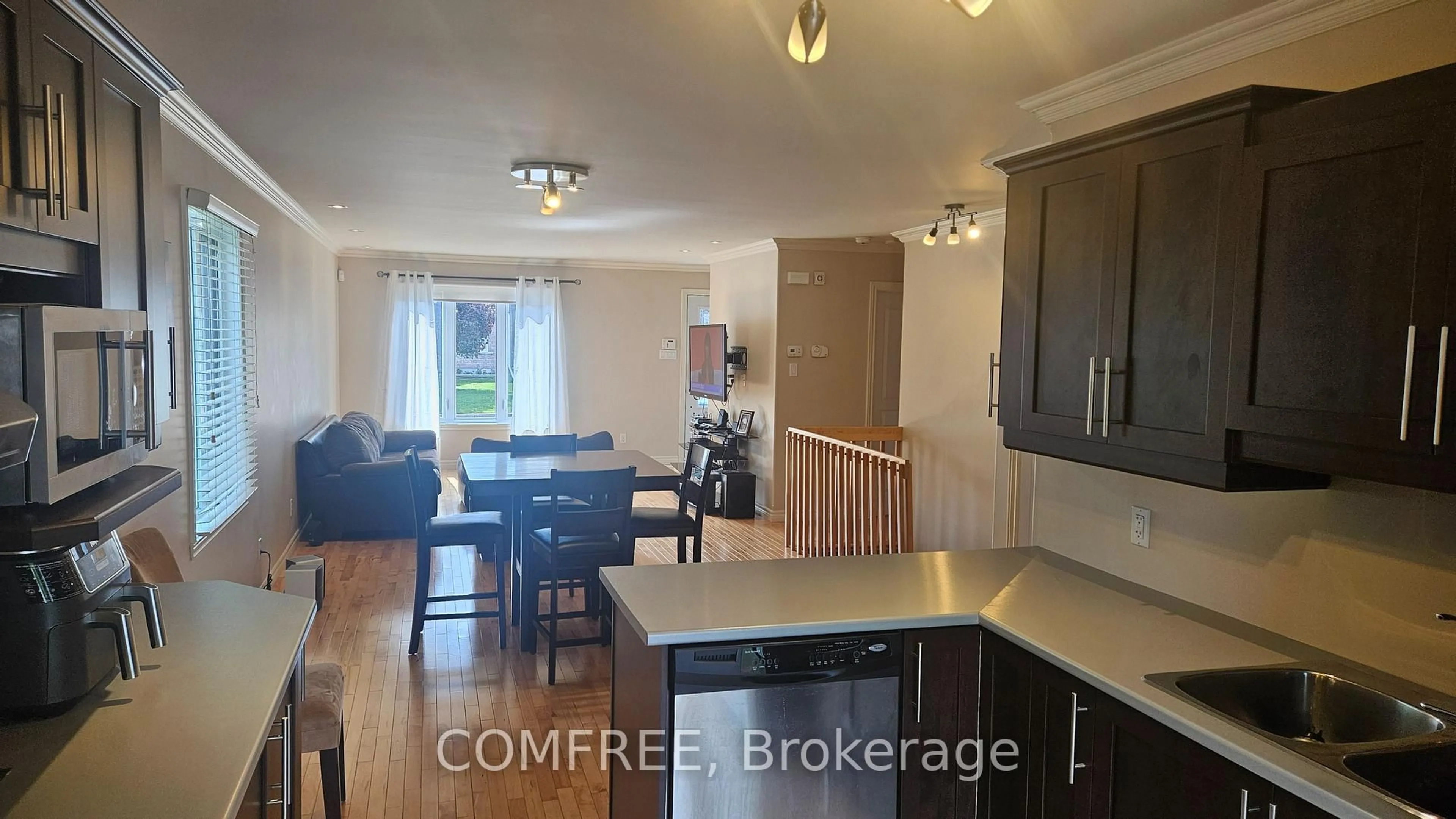 Open concept kitchen, wood/laminate floor for 410 Marc Andre St, Hawkesbury Ontario K6A 0A5